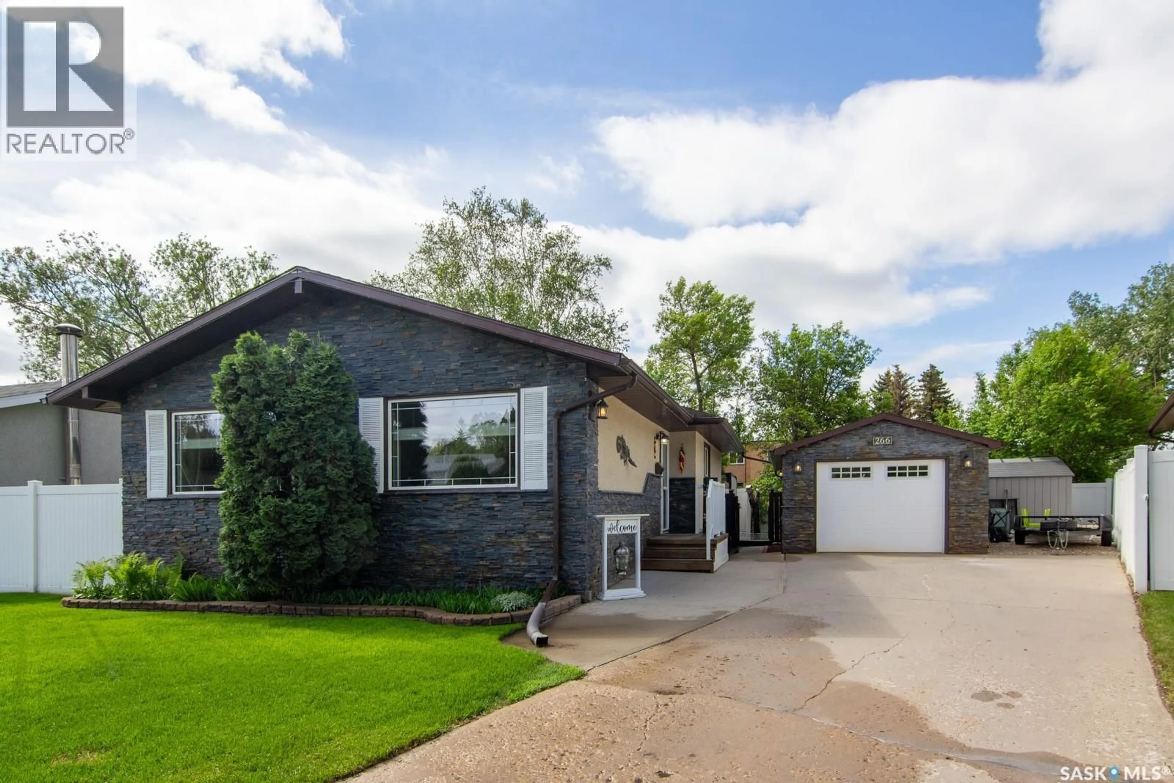 Home with vinyl exterior material, street for 266 ALBANY CRESCENT, Saskatoon Saskatchewan S7K3X8
