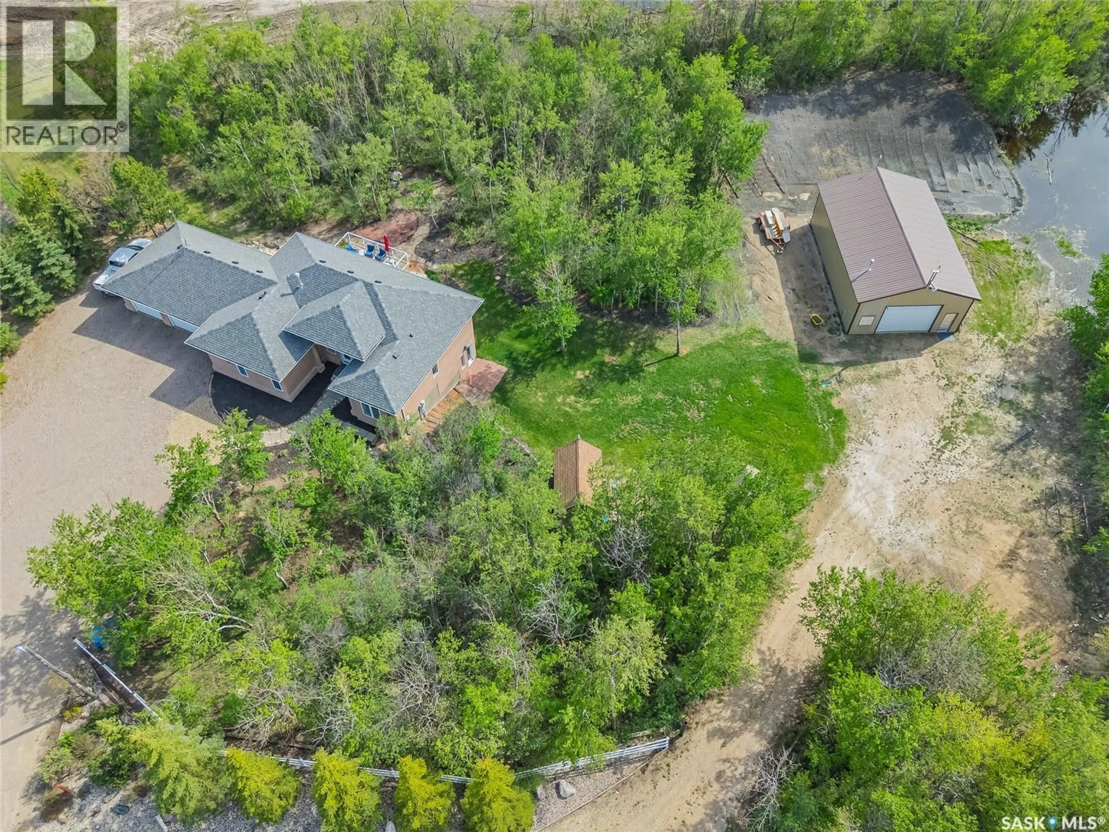 A pic from outside/outdoor area/front of a property/back of a property/a pic from drone, forest/trees view for 2 DISCOVERY TRAIL, Corman Park Rm No. 344 Saskatchewan S7K3J9