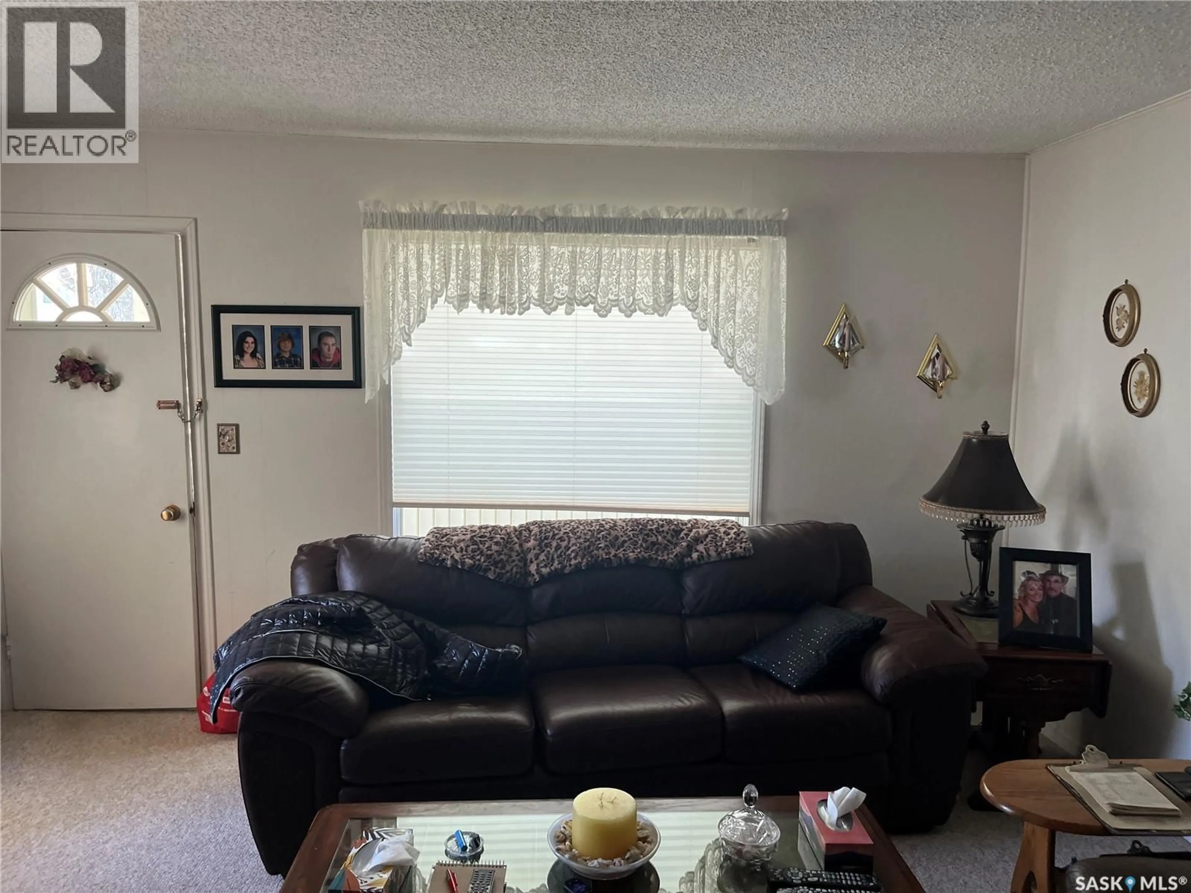 Living room with furniture, unknown for 98 3RD STREET, Wadena Saskatchewan S0A4J0