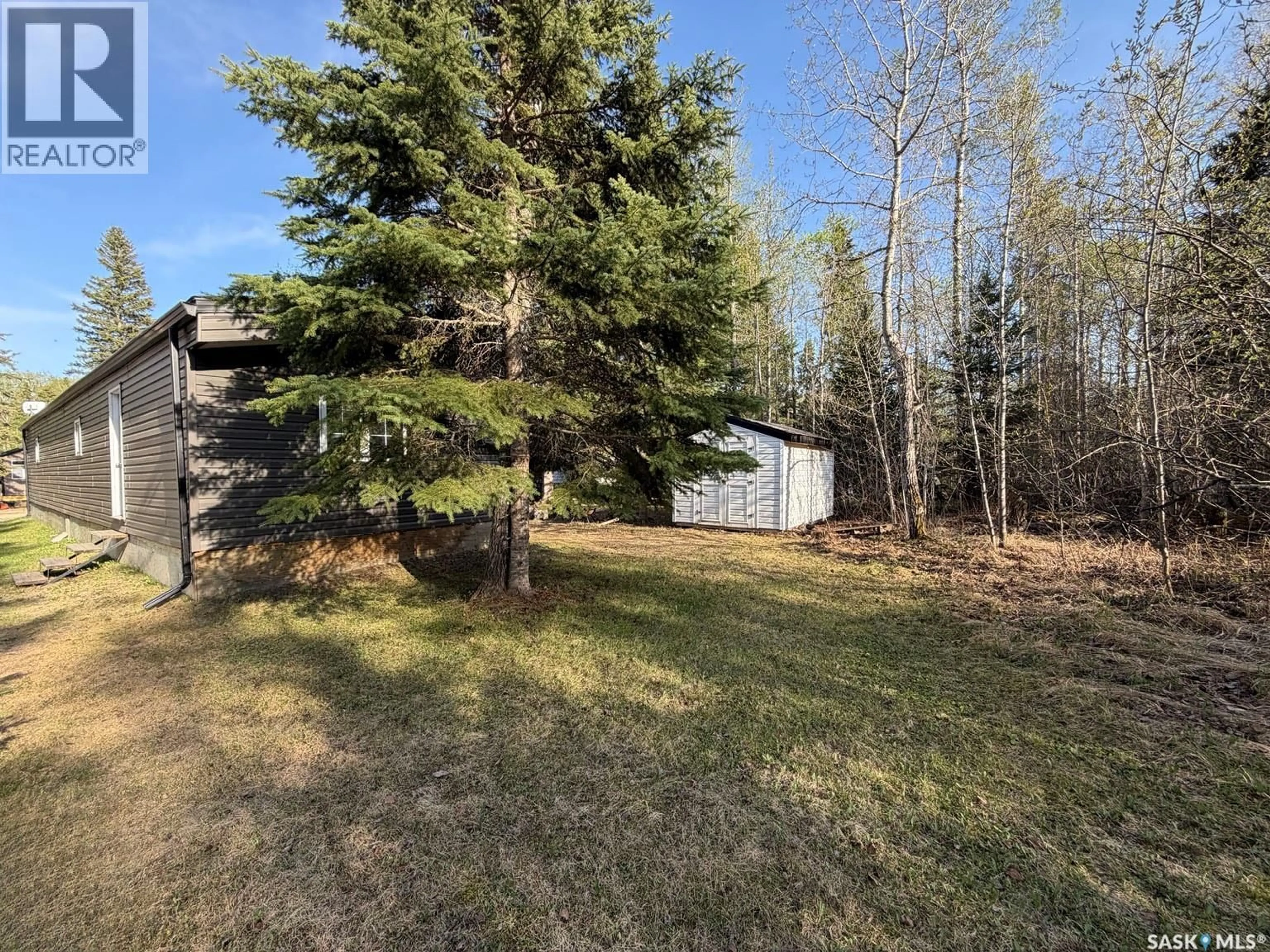 A pic from outside/outdoor area/front of a property/back of a property/a pic from drone, forest/trees view for A27 - 150 OKEMA BEACH ROAD, Lakeland Rm No. 521 Saskatchewan S0J0N0