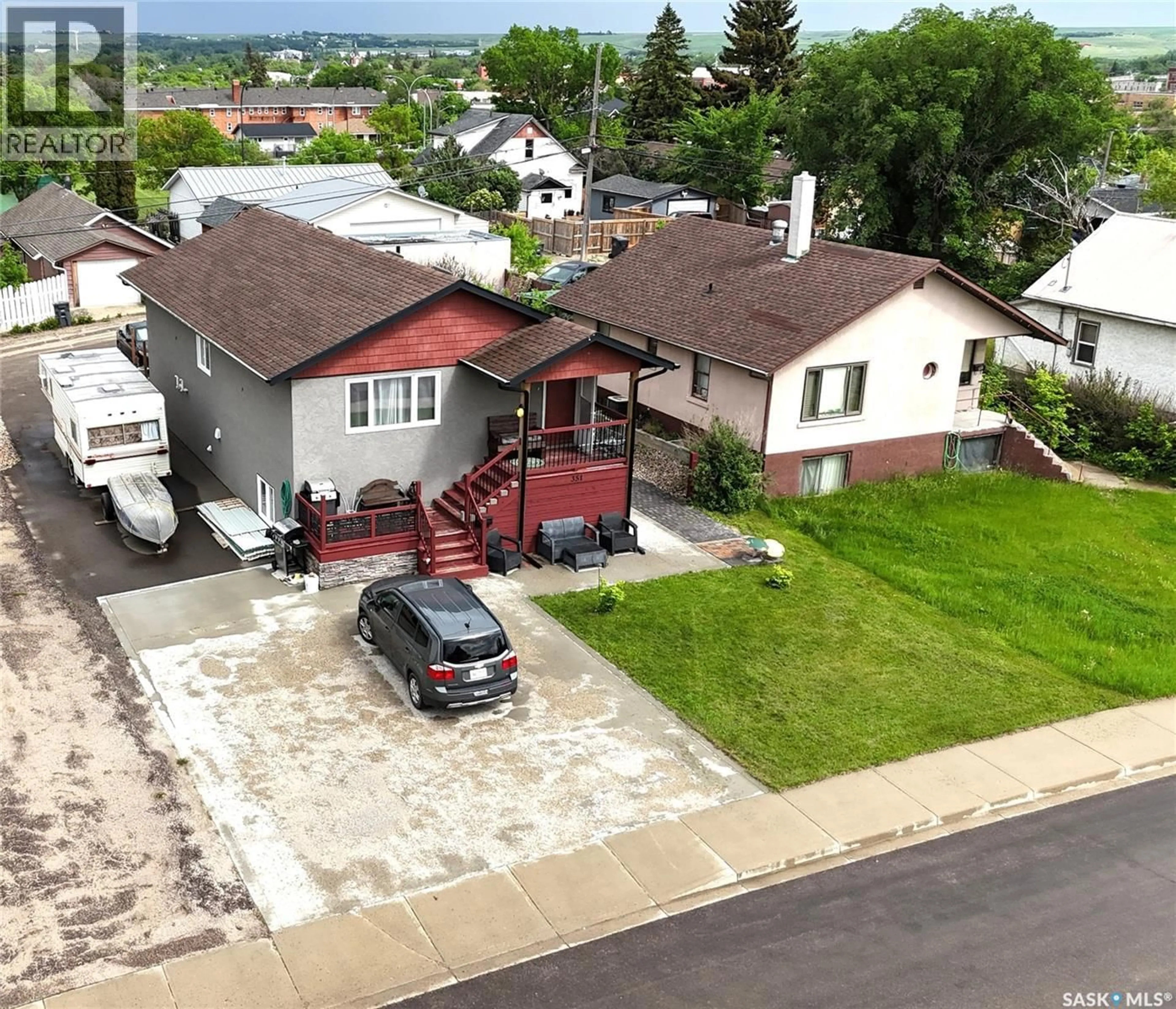 A pic from outside/outdoor area/front of a property/back of a property/a pic from drone, street for 351 4TH AVENUE, Swift Current Saskatchewan S9H0V1