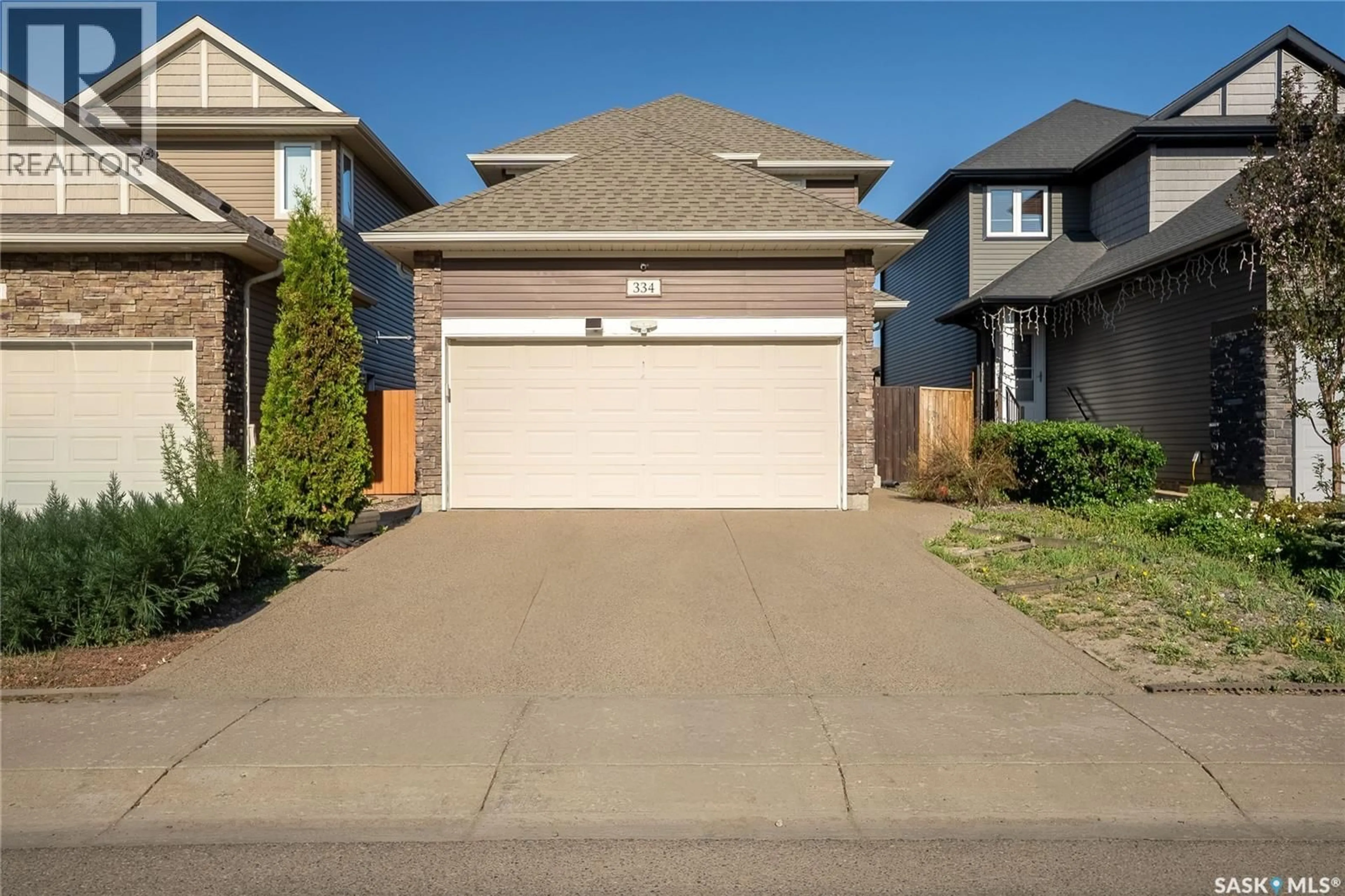 Home with vinyl exterior material, street for 334 DICKSON CRESCENT, Saskatoon Saskatchewan S7T0T8