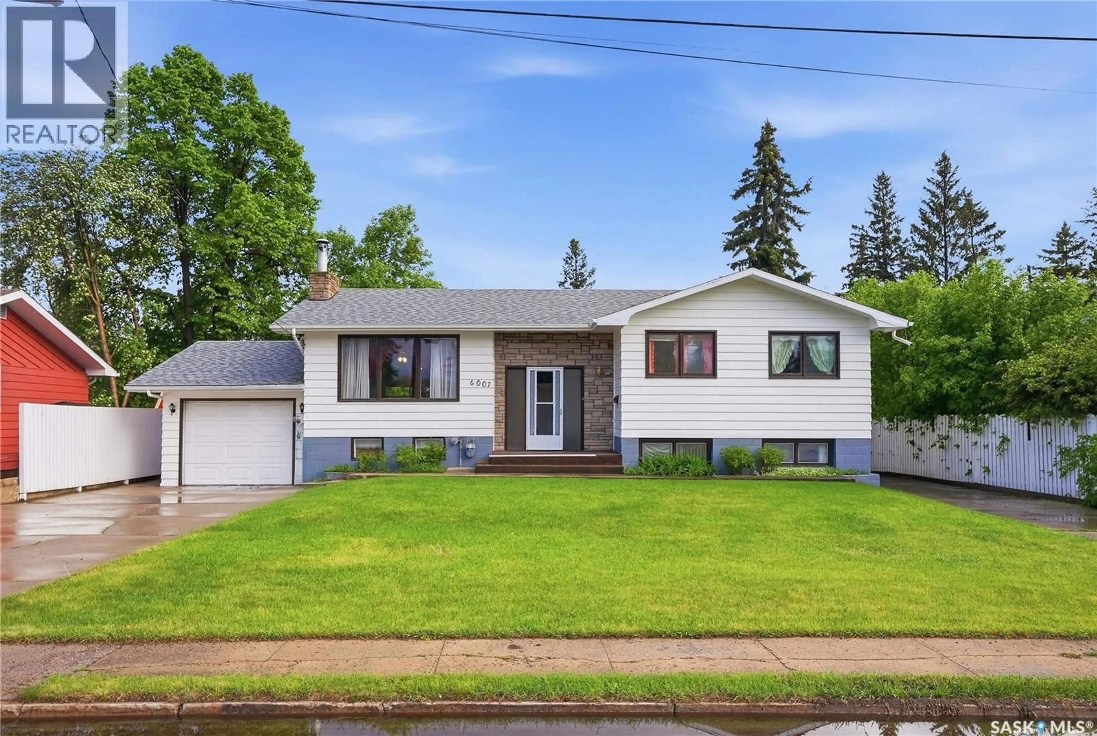 Home with vinyl exterior material, street for 6007 4TH STREET, Rosthern Saskatchewan S0K3R0