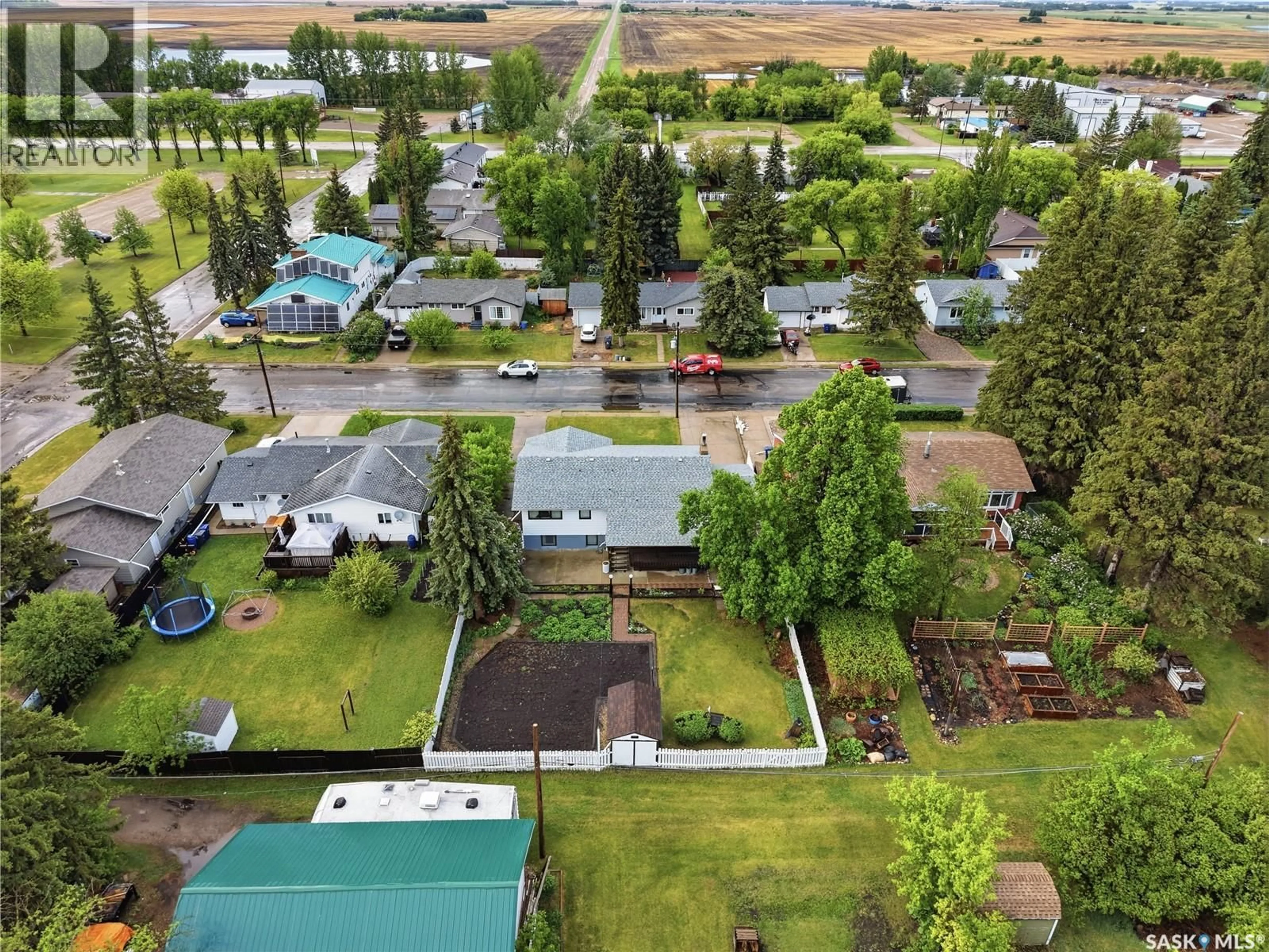 A pic from outside/outdoor area/front of a property/back of a property/a pic from drone, unknown for 6007 4TH STREET, Rosthern Saskatchewan S0K3R0