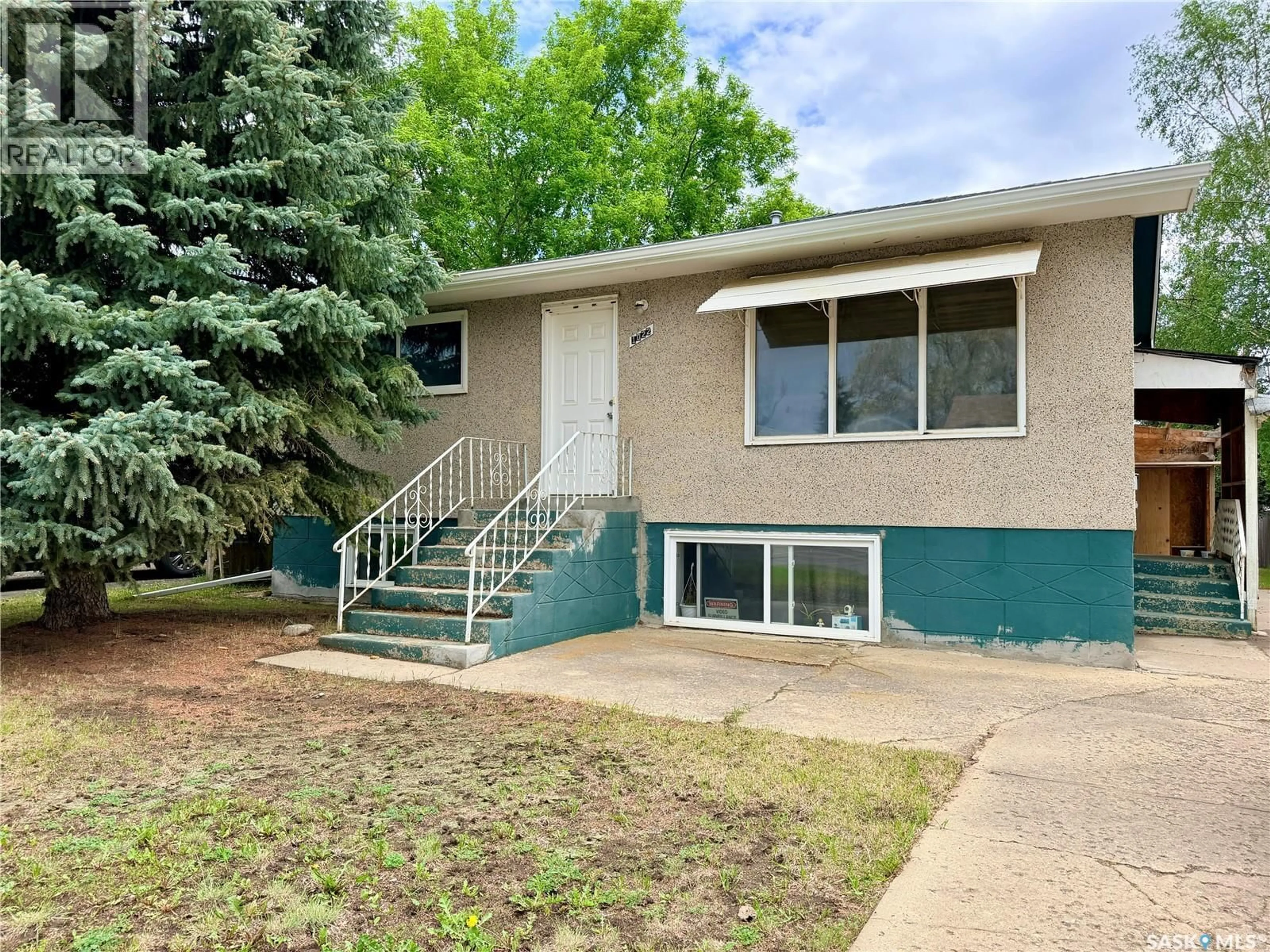 Home with vinyl exterior material, street for 1022 110TH STREET, North Battleford Saskatchewan S9A2H4