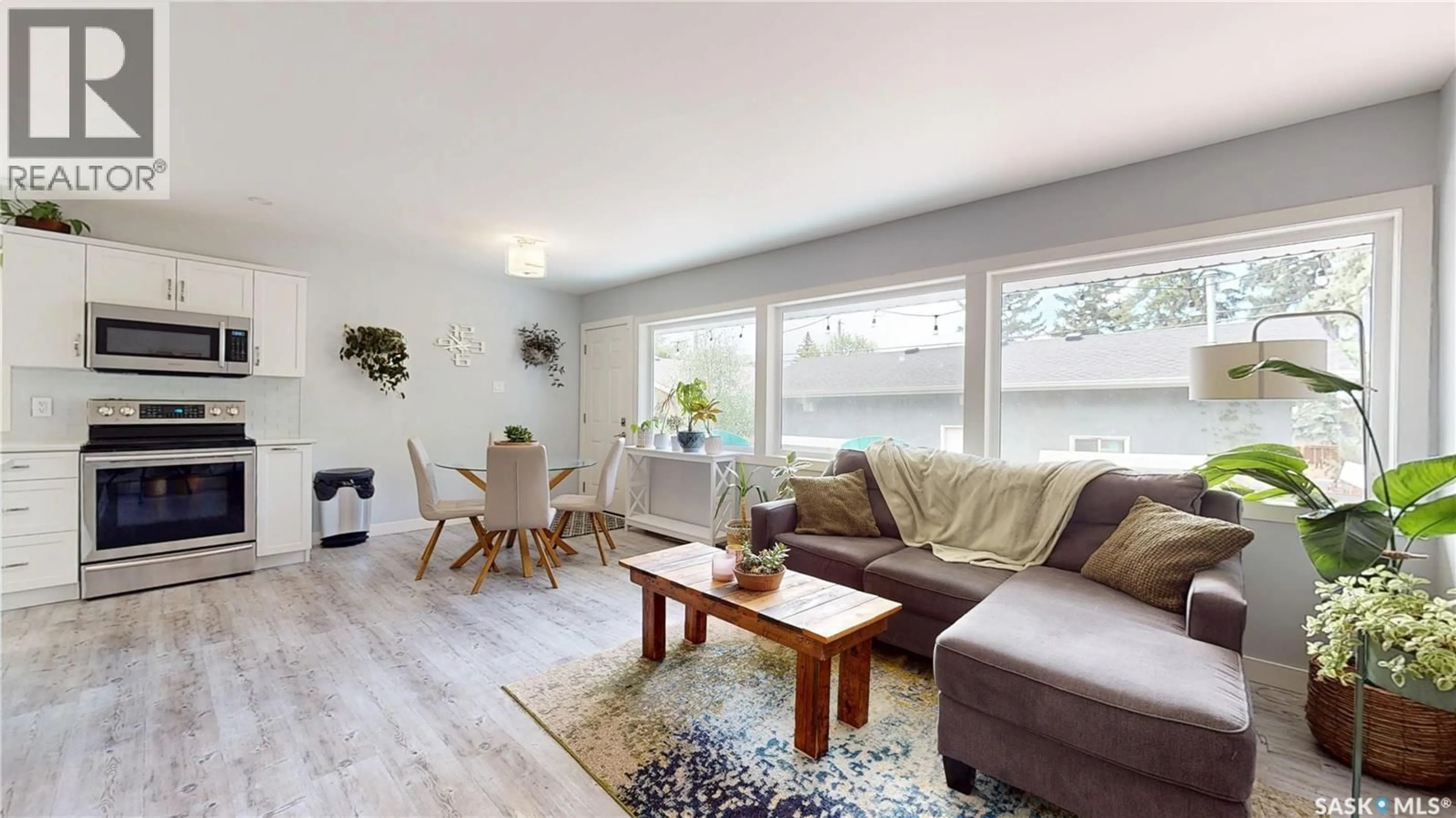 Living room with furniture, wood/laminate floor for 3231 HILL AVENUE, Regina Saskatchewan S4S0W5