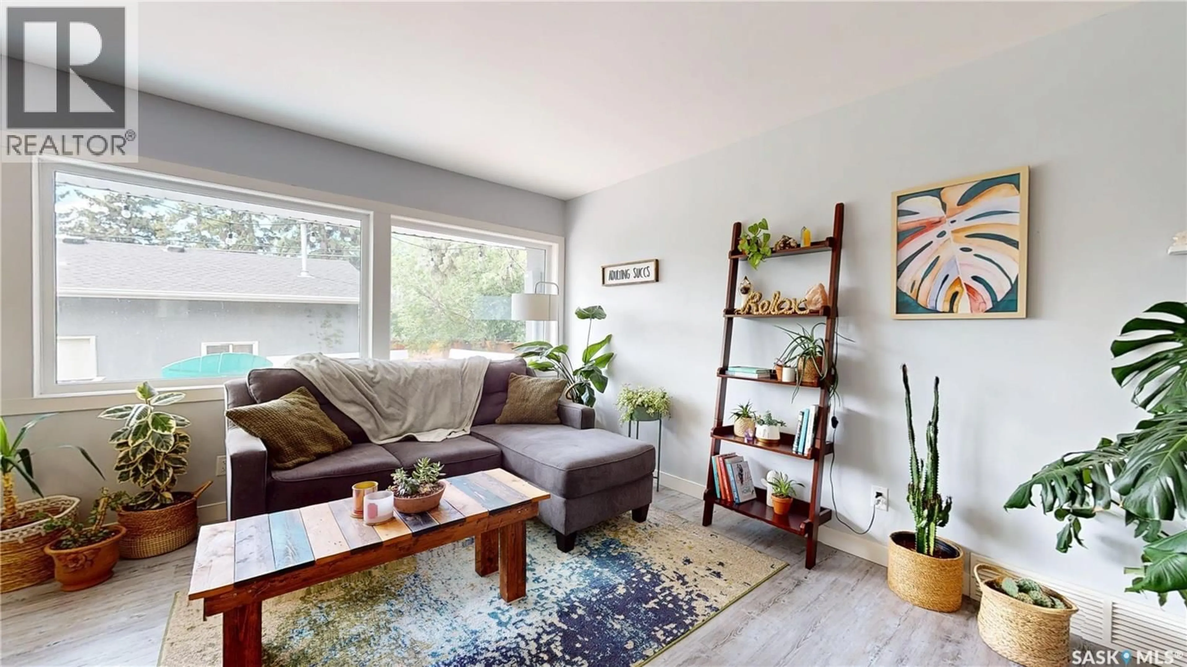 Living room with furniture, wood/laminate floor for 3231 HILL AVENUE, Regina Saskatchewan S4S0W5