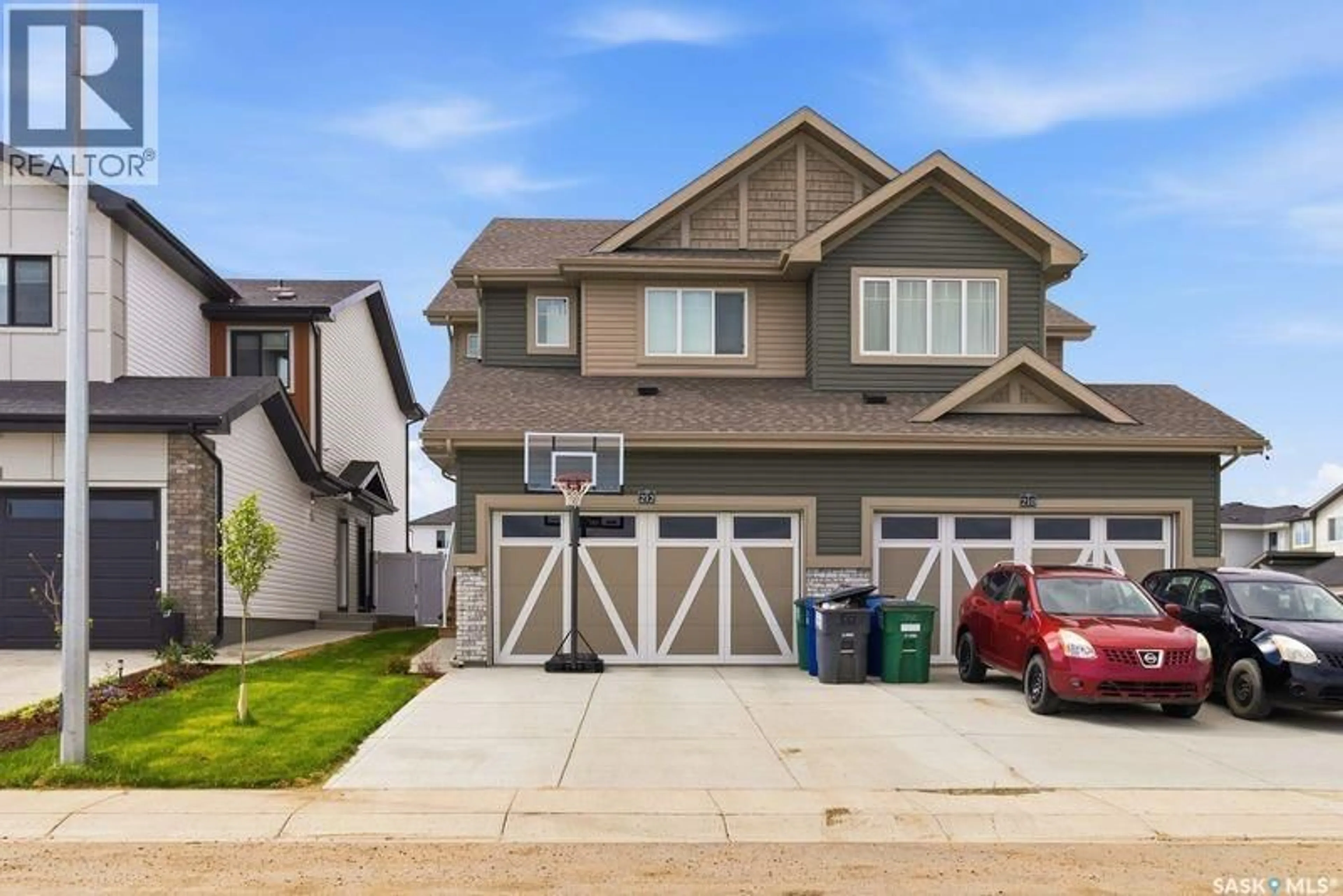 Home with vinyl exterior material, street for 212 MYLES HEIDT LANE, Saskatoon Saskatchewan S7W1J1