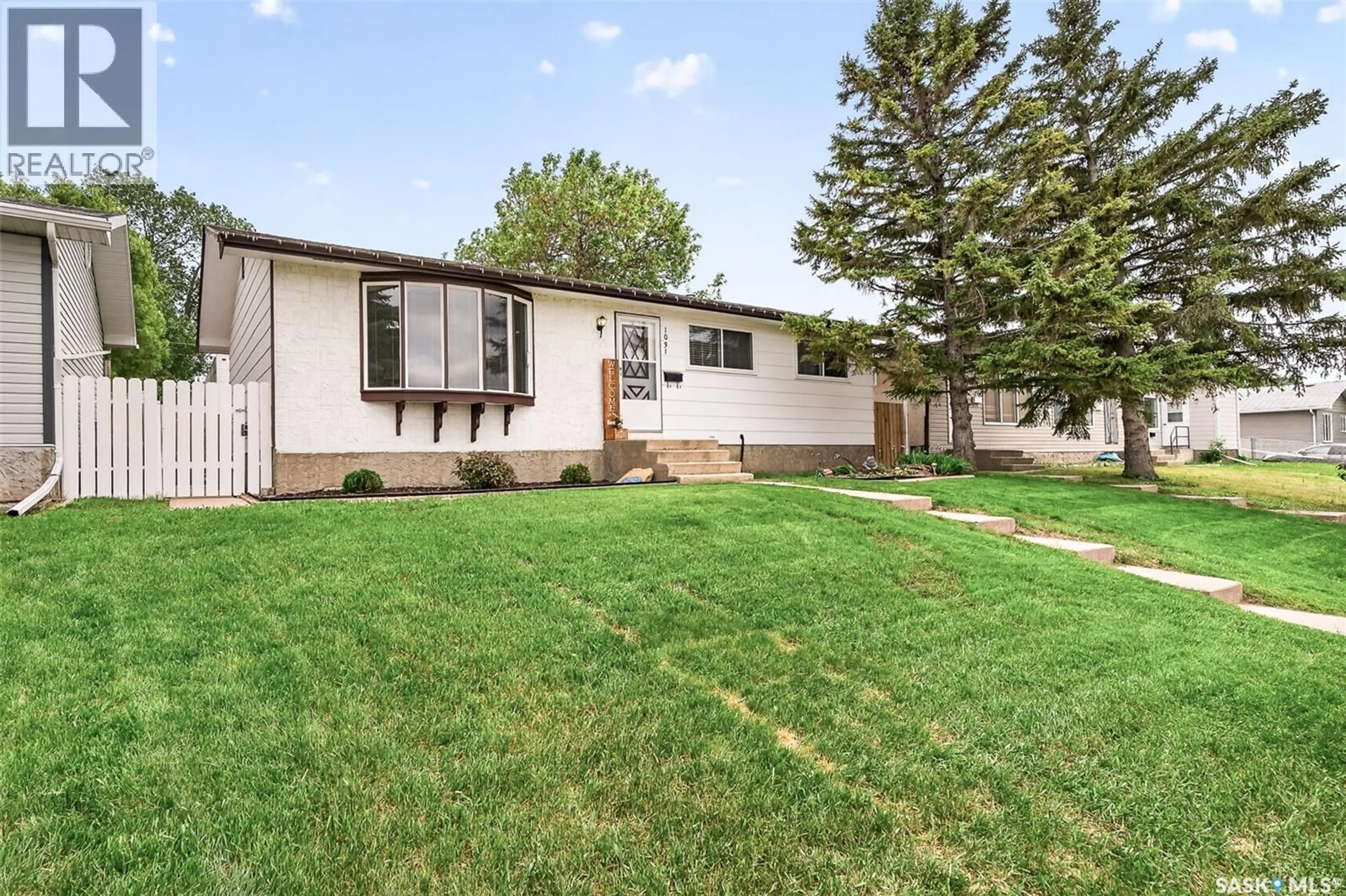Home with vinyl exterior material, street for 1031 ROSS STREET, Moose Jaw Saskatchewan S6H7H4