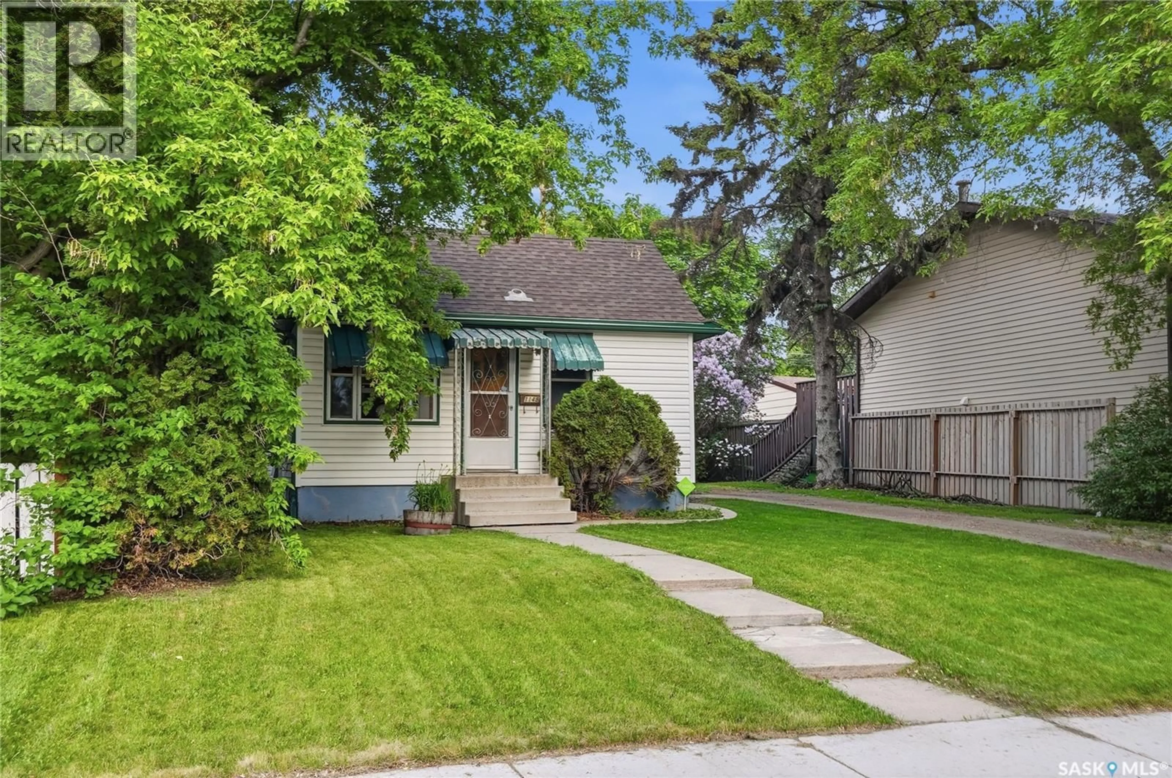 Home with vinyl exterior material, street for 1148 K AVENUE, Saskatoon Saskatchewan S7N2N8
