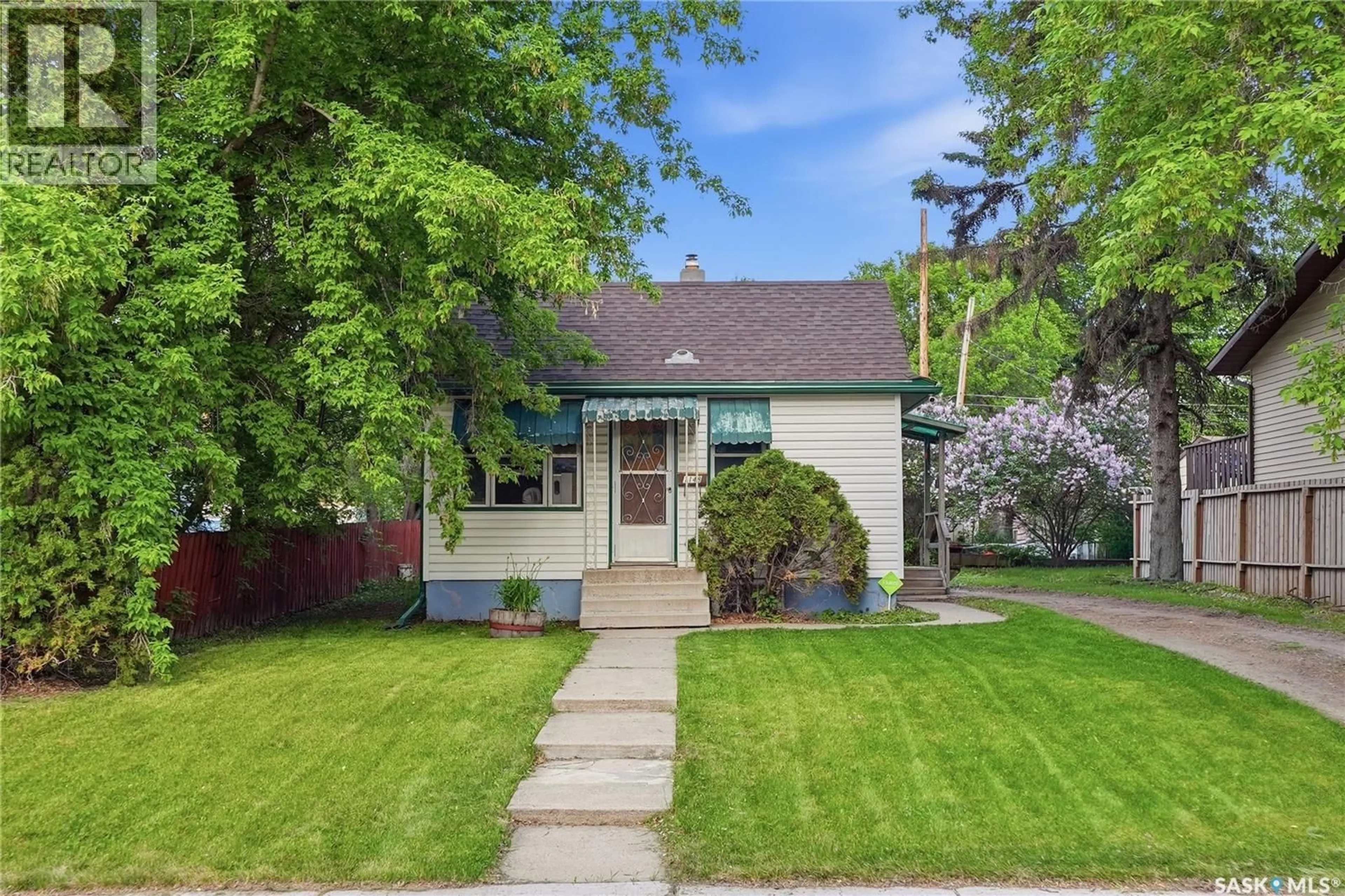 Home with vinyl exterior material, street for 1148 K AVENUE, Saskatoon Saskatchewan S7N2N8