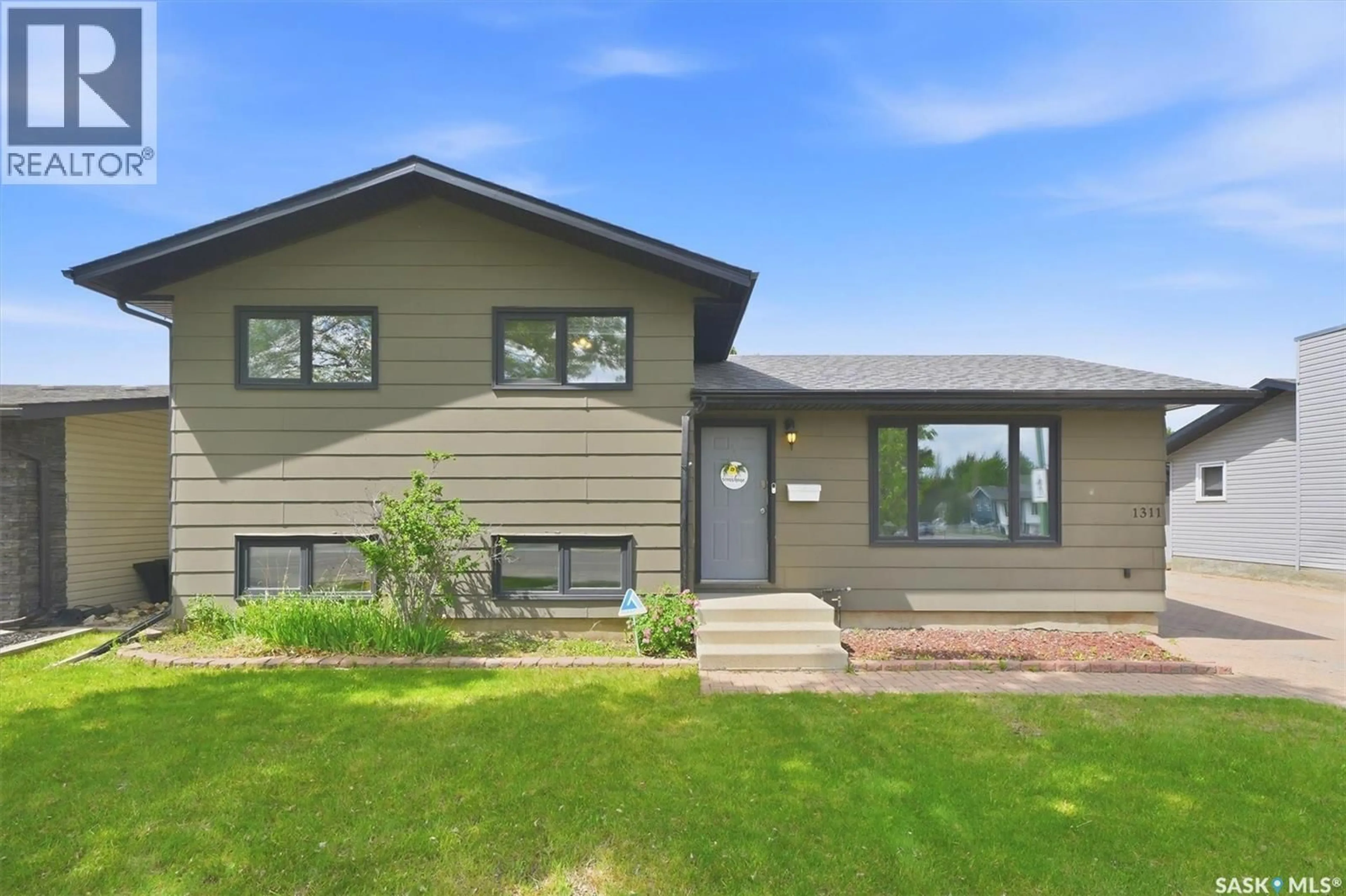 Home with vinyl exterior material, street for 1311 LATRACE ROAD, Saskatoon Saskatchewan S7L6E4