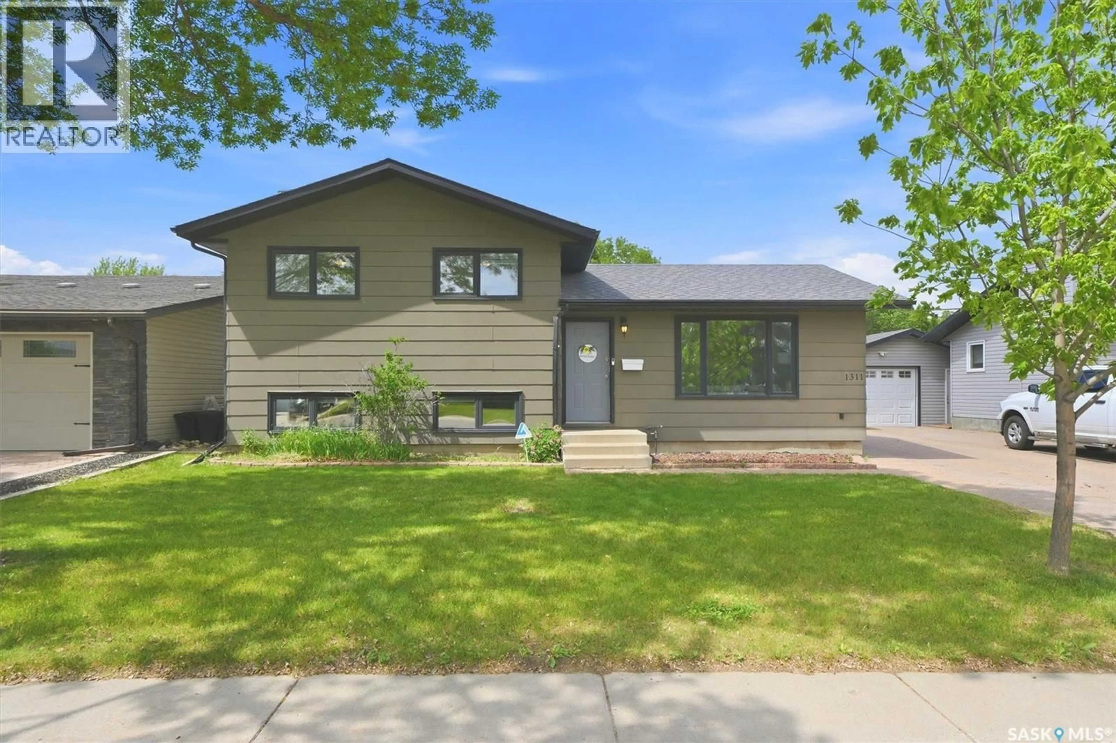 Home with vinyl exterior material, street for 1311 LATRACE ROAD, Saskatoon Saskatchewan S7L6E4