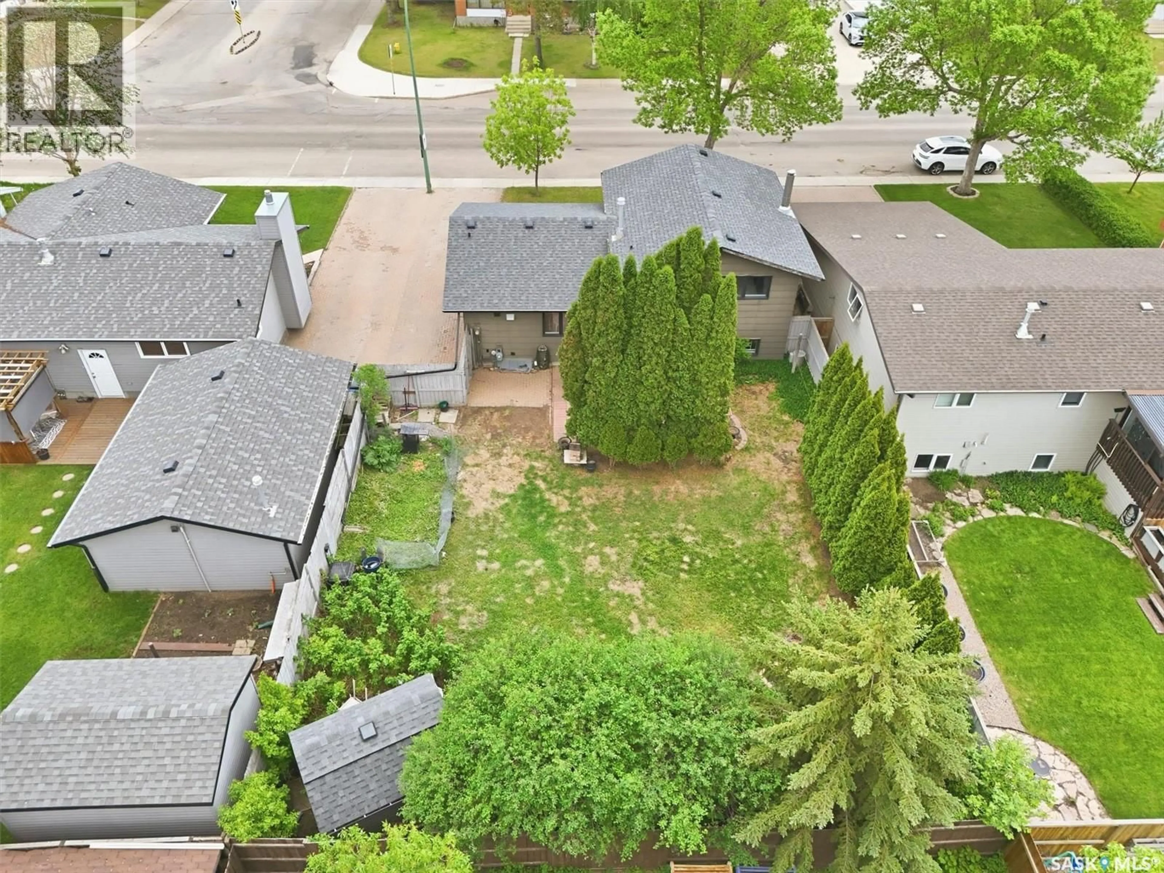 A pic from outside/outdoor area/front of a property/back of a property/a pic from drone, street for 1311 LATRACE ROAD, Saskatoon Saskatchewan S7L6E4