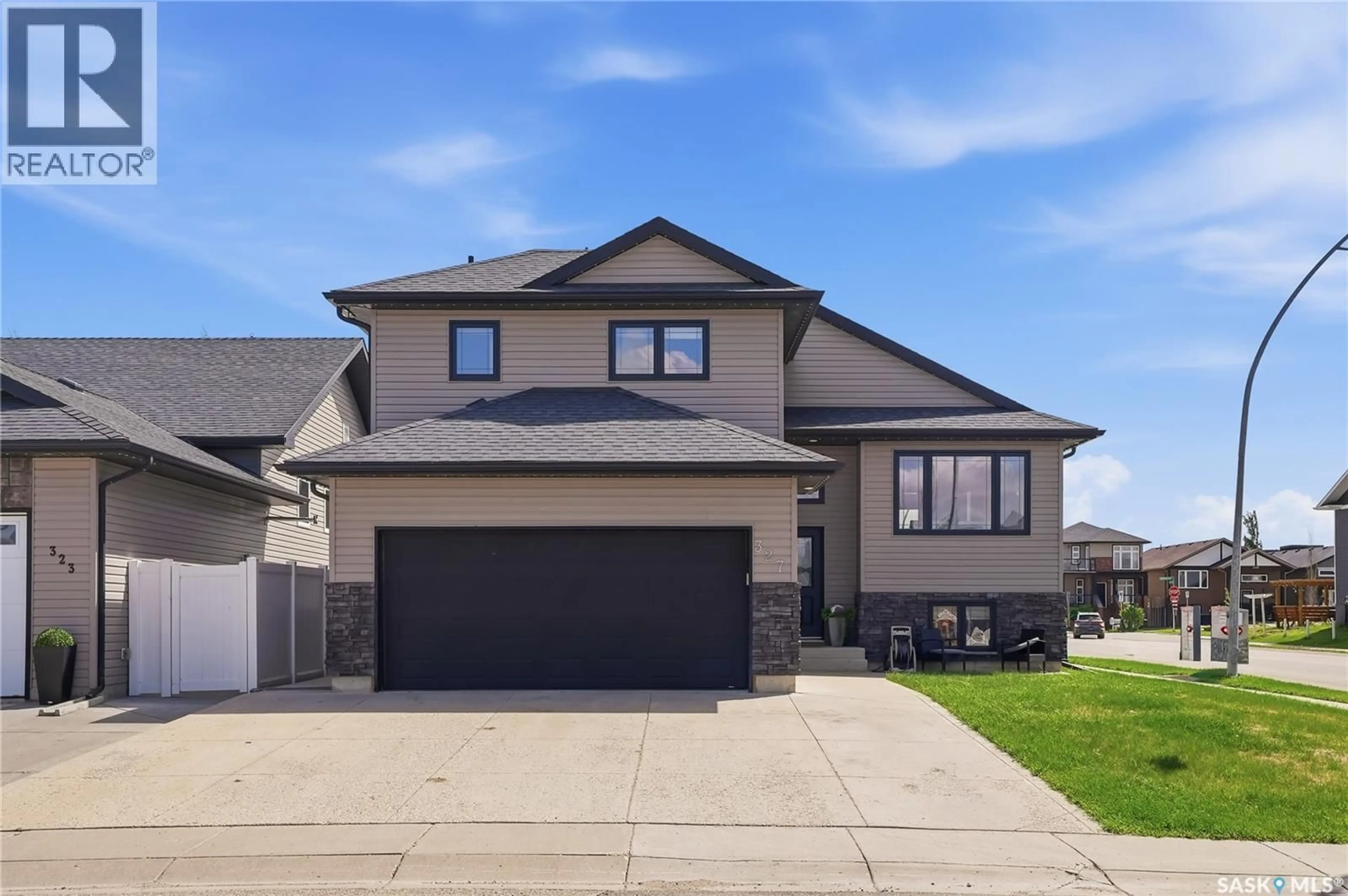 Home with vinyl exterior material, street for 327 ROY CRESCENT, Saskatoon Saskatchewan S7W0L1