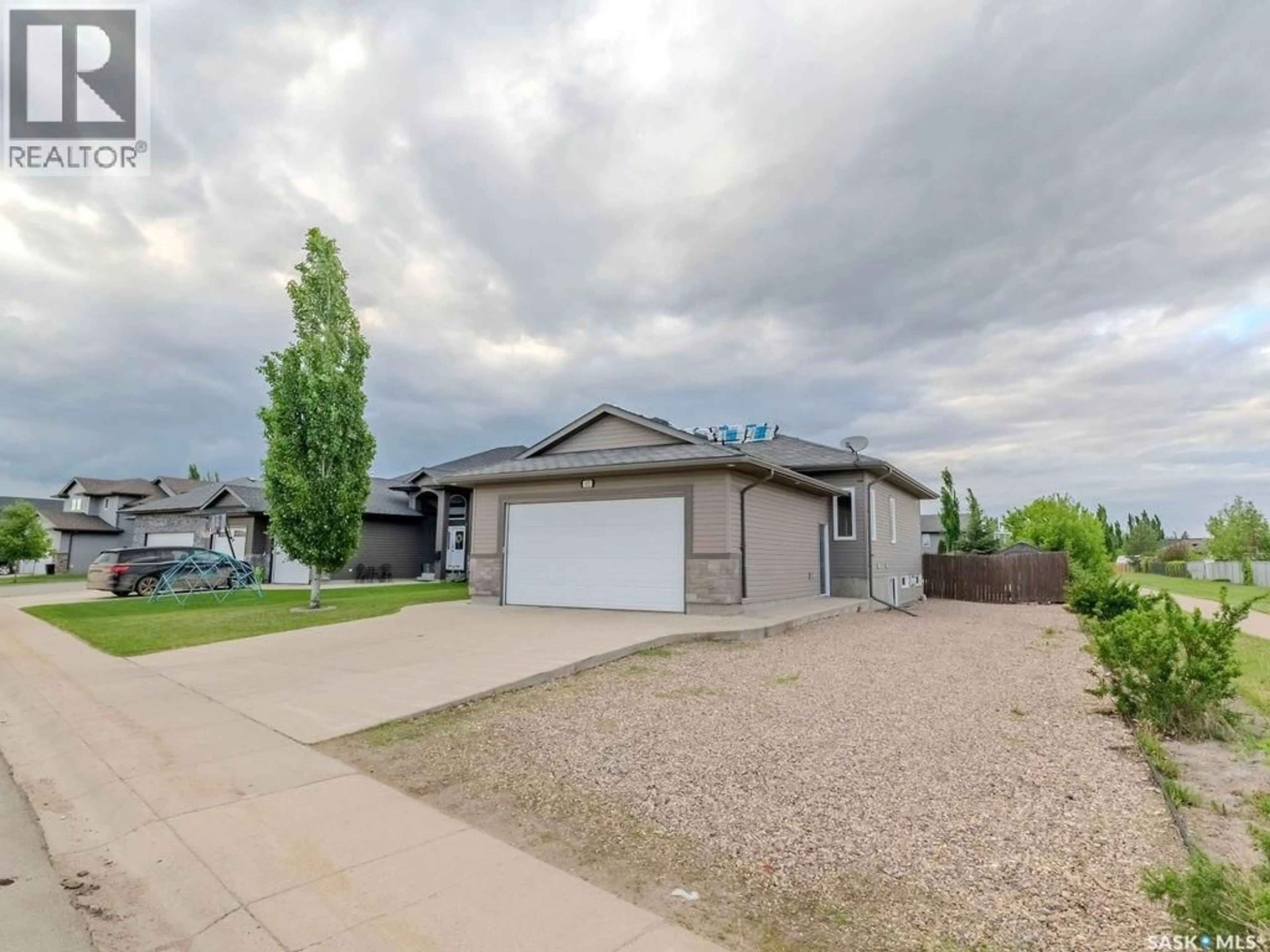 A pic from outside/outdoor area/front of a property/back of a property/a pic from drone, street for 625 REIMER ROAD, Martensville Saskatchewan S0K0A2