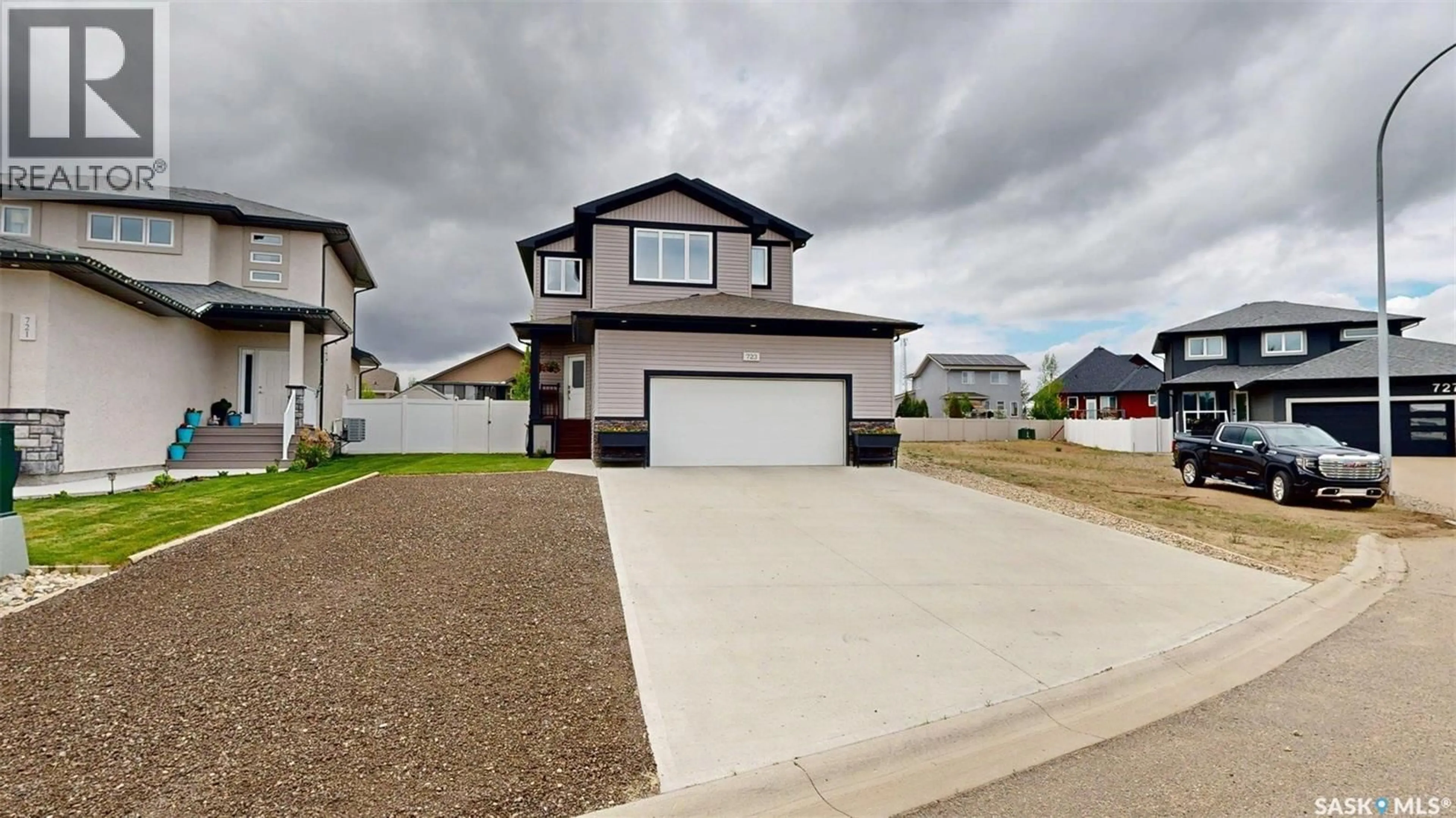 Home with vinyl exterior material, street for 723 ASPEN CRESCENT, Pilot Butte Saskatchewan S0G3Z0