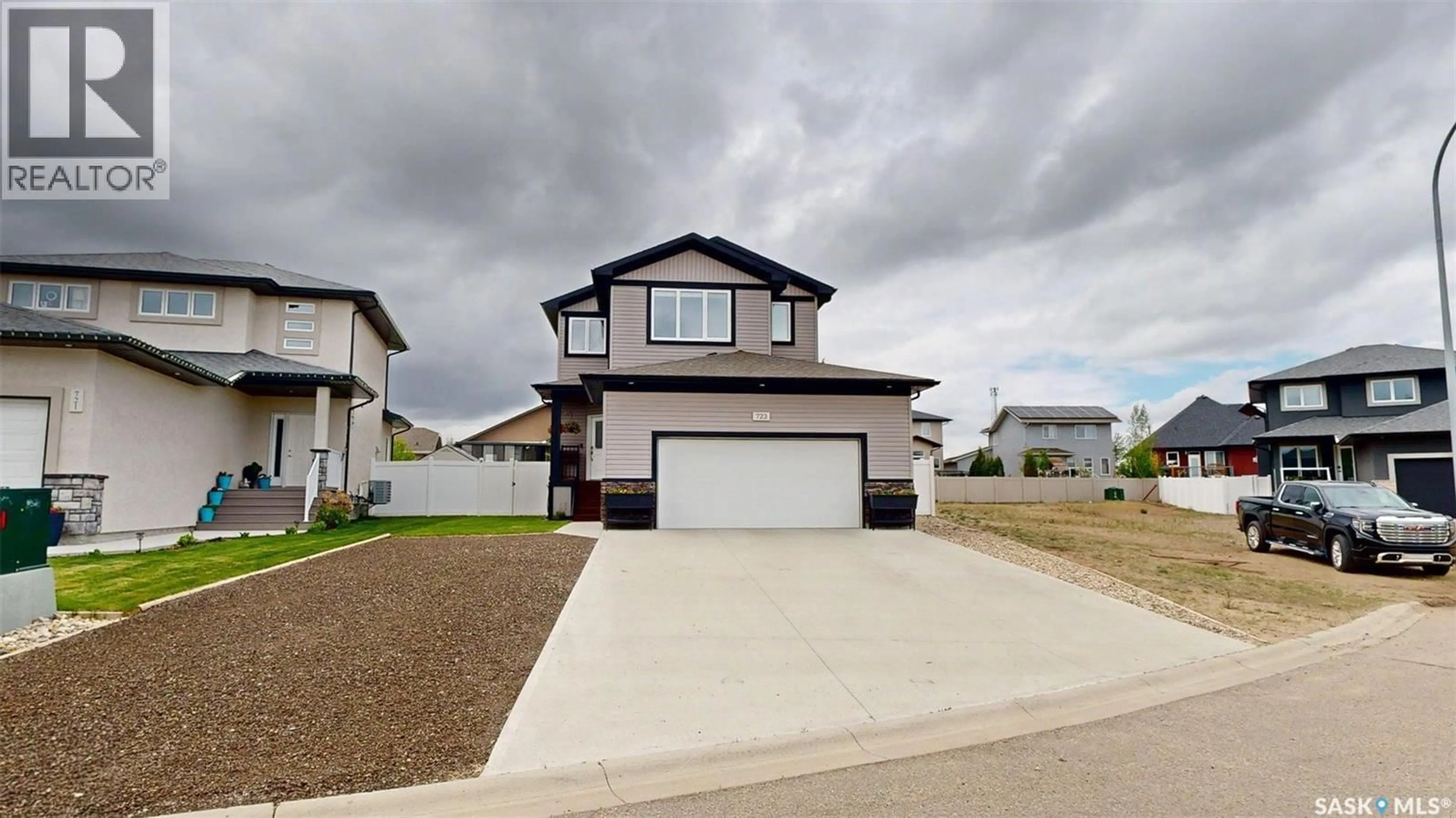 Home with vinyl exterior material, street for 723 ASPEN CRESCENT, Pilot Butte Saskatchewan S0G3Z0