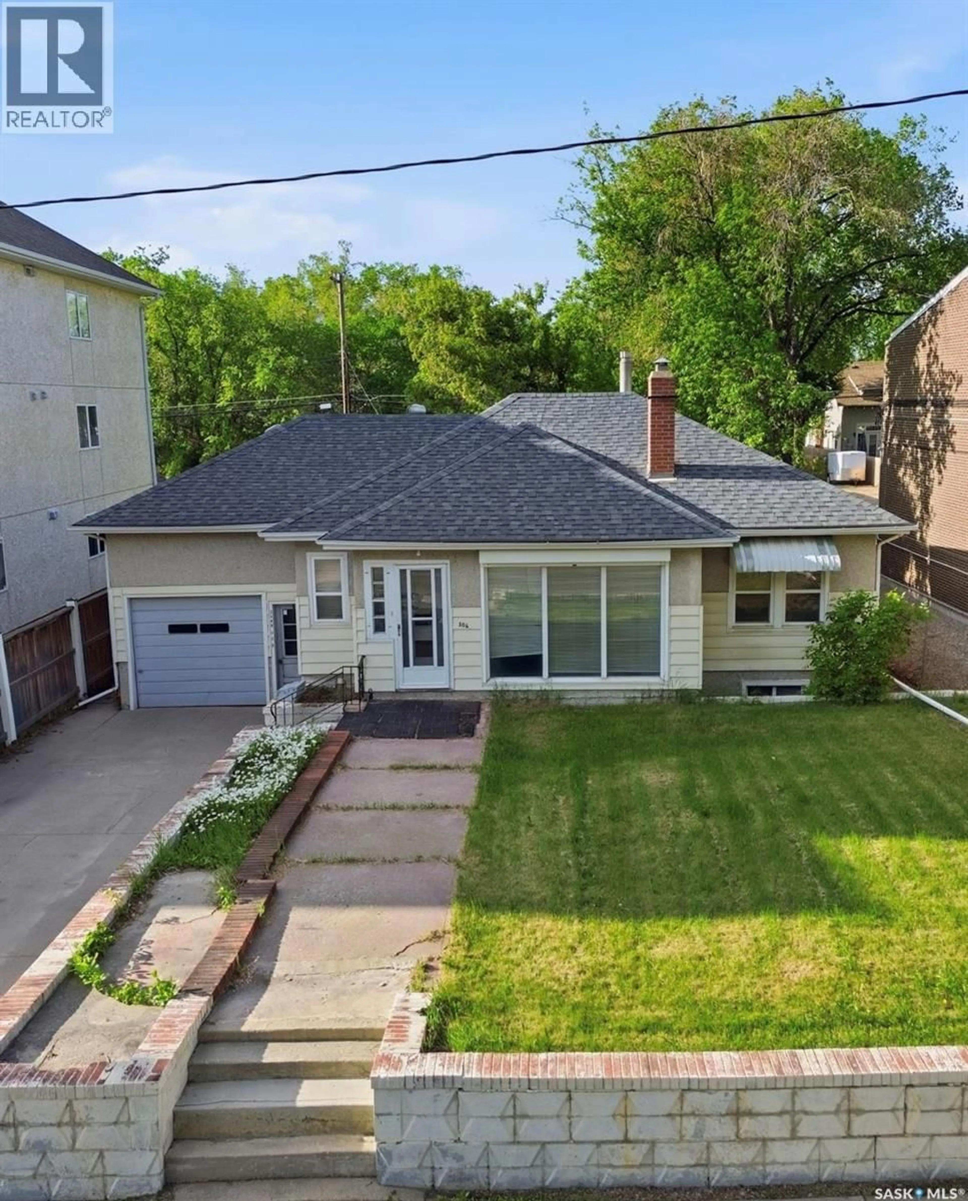 A pic from outside/outdoor area/front of a property/back of a property/a pic from drone, street for 306 108TH STREET, Saskatoon Saskatchewan S7N1P8