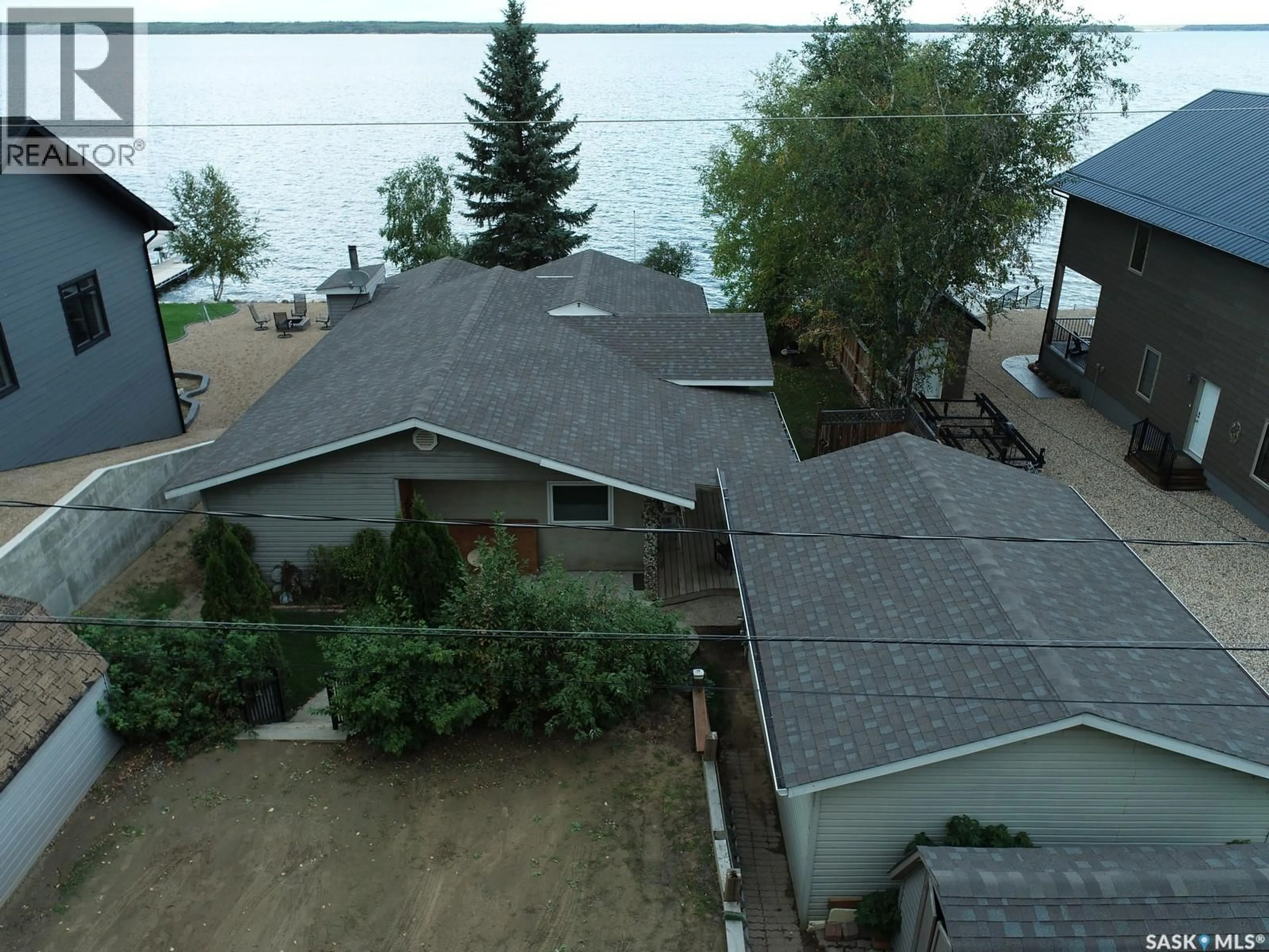A pic from outside/outdoor area/front of a property/back of a property/a pic from drone, water/lake/river/ocean view for 1118 BIRCH AVENUE, Tobin Lake Saskatchewan S0E1E0