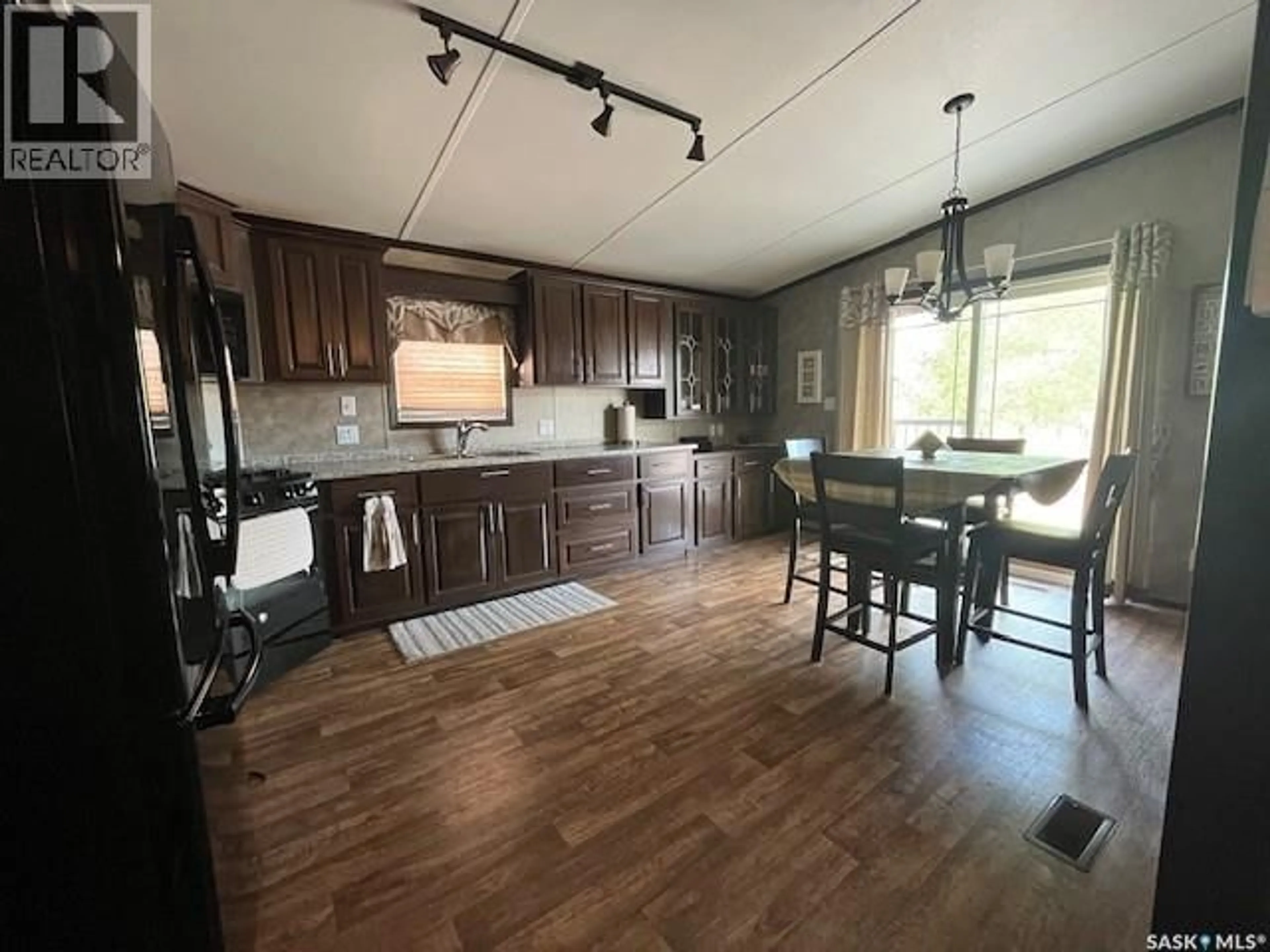 Open concept kitchen, wood/laminate floor for 1207 OAK AVENUE, Beaver River Rm No. 622 Saskatchewan S0M1A0