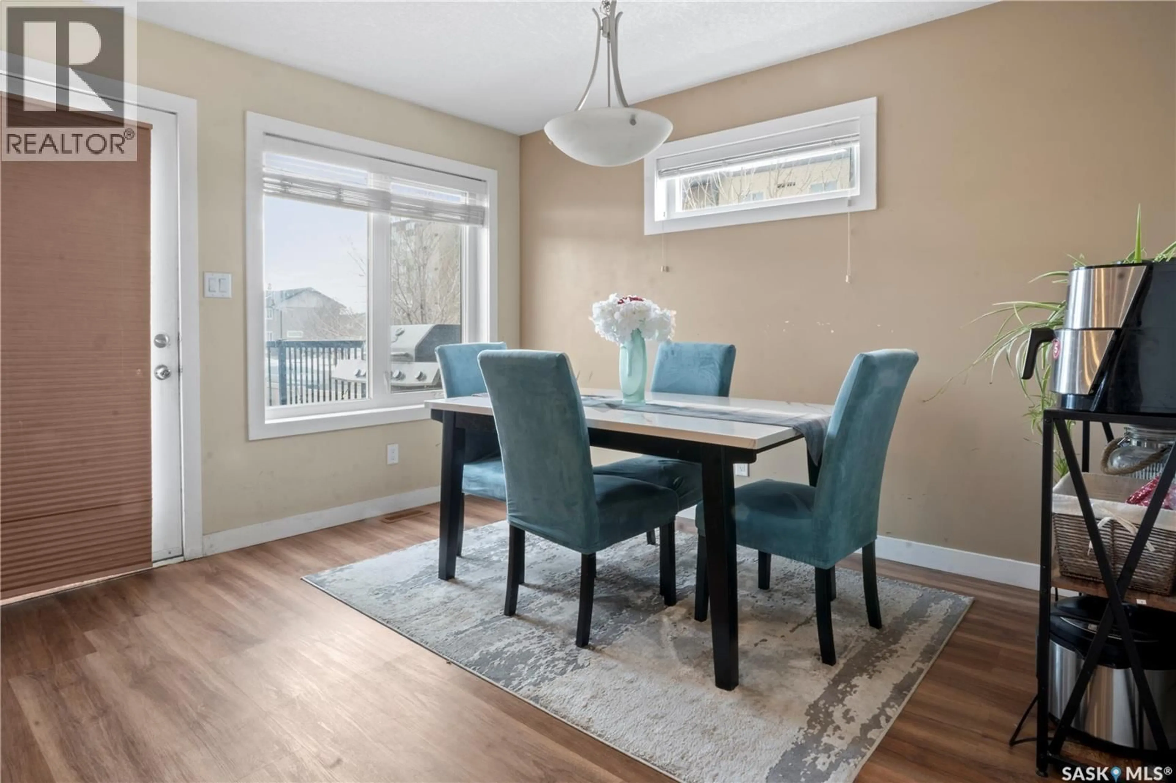 Dining room, wood/laminate floor for 5449 JIM CAIRNS BOULEVARD, Regina Saskatchewan S4W0G1