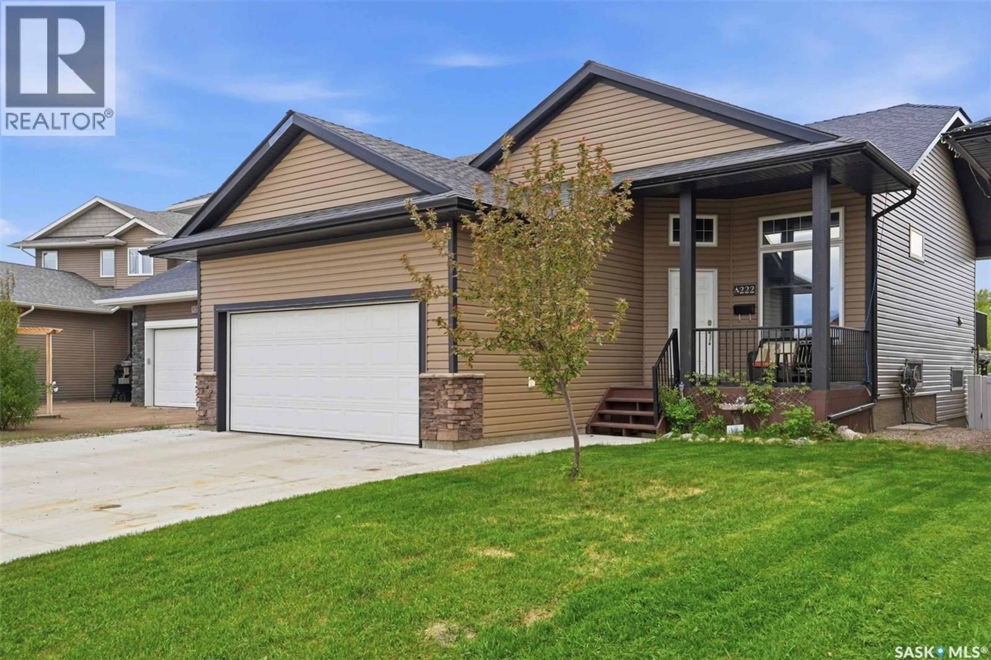 Home with brick exterior material, street for 222 PARKVIEW COVE, Osler Saskatchewan S0K3A0