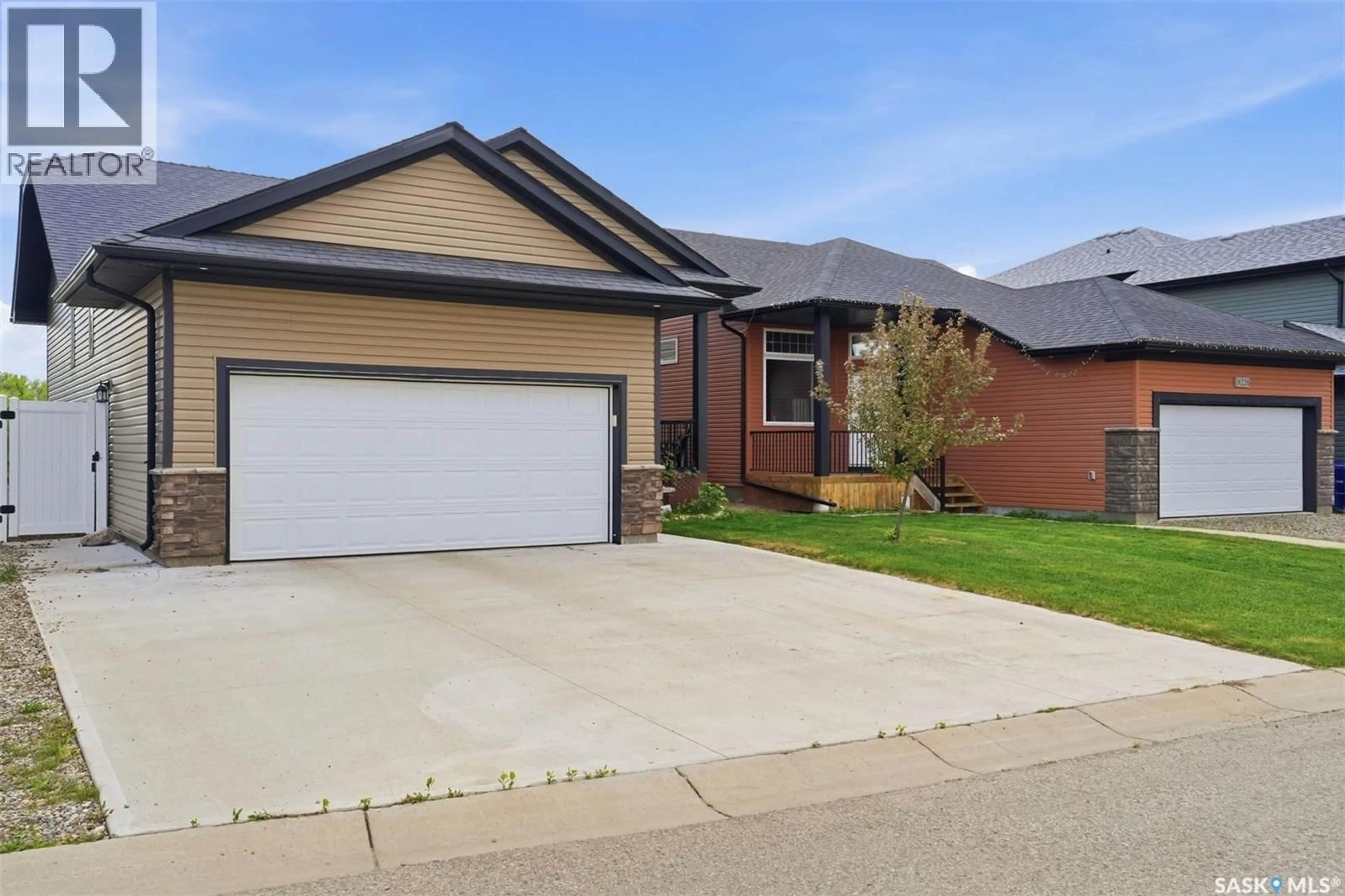 Home with brick exterior material, street for 222 PARKVIEW COVE, Osler Saskatchewan S0K3A0