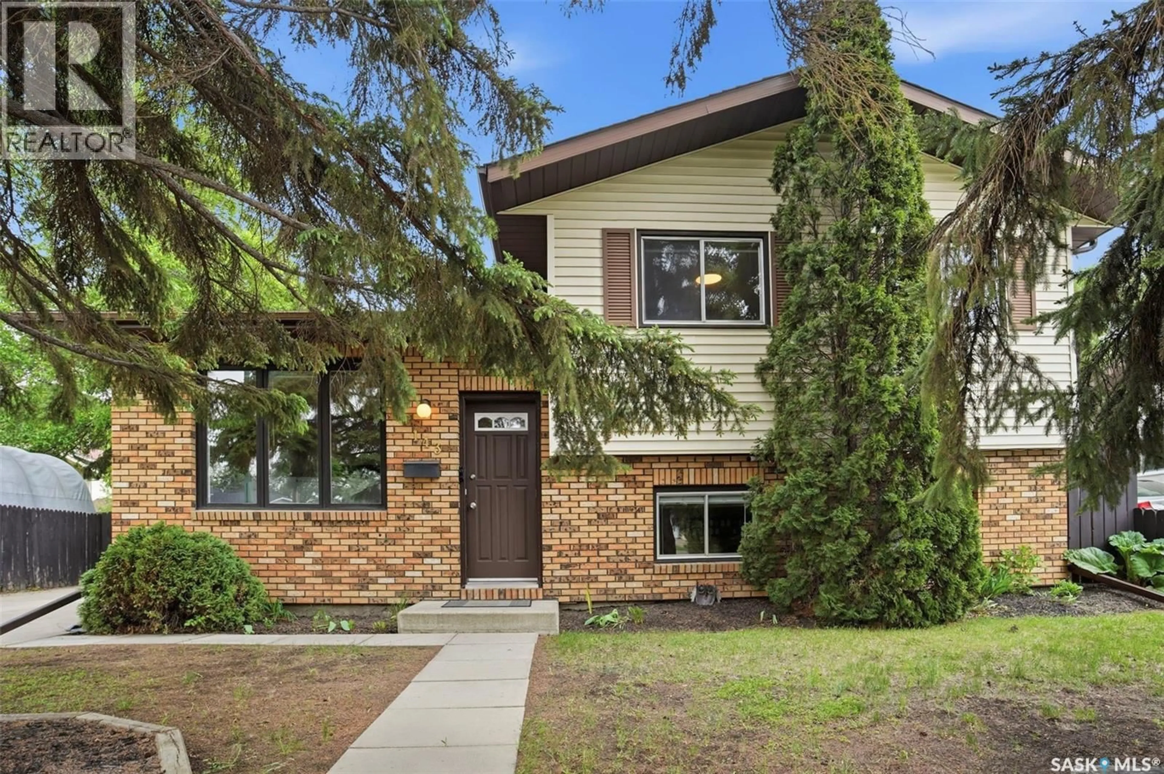 Home with brick exterior material, street for 143 ADILMAN DRIVE, Saskatoon Saskatchewan S7K7P3