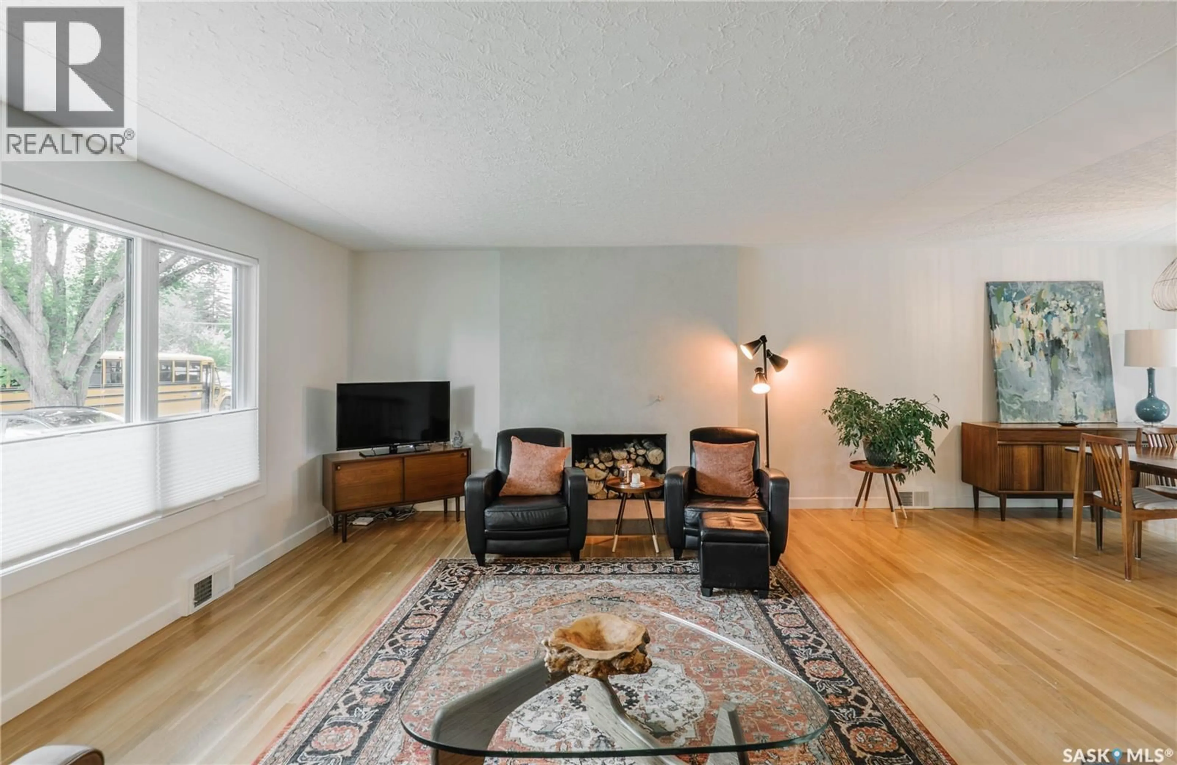 Living room with furniture, wood/laminate floor for 414 LAKE CRESCENT, Saskatoon Saskatchewan S7H3A4