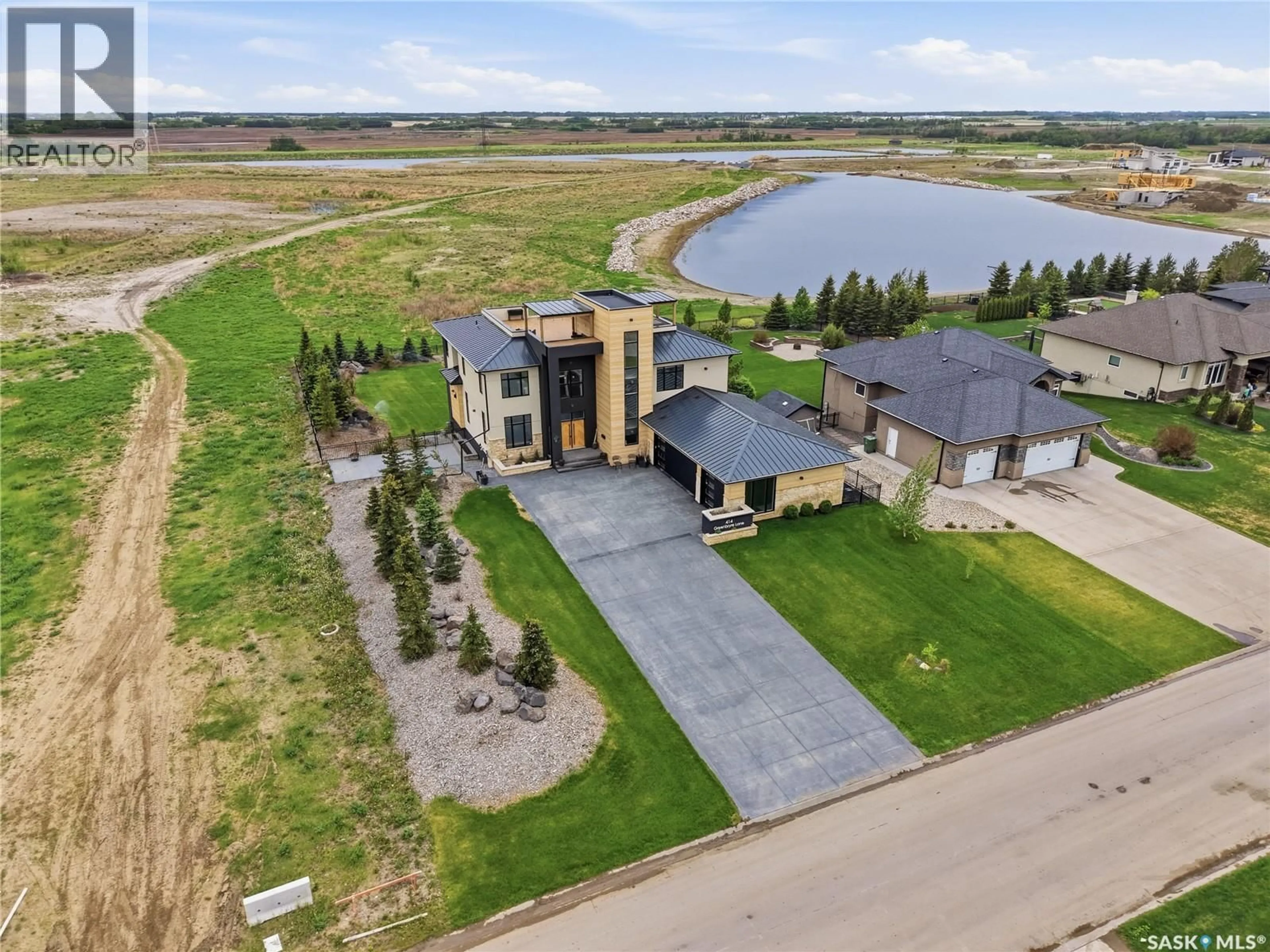 A pic from outside/outdoor area/front of a property/back of a property/a pic from drone, water/lake/river/ocean view for 414 GREENBRYRE LANE, Corman Park Rm No. 344 Saskatchewan S7V0H8