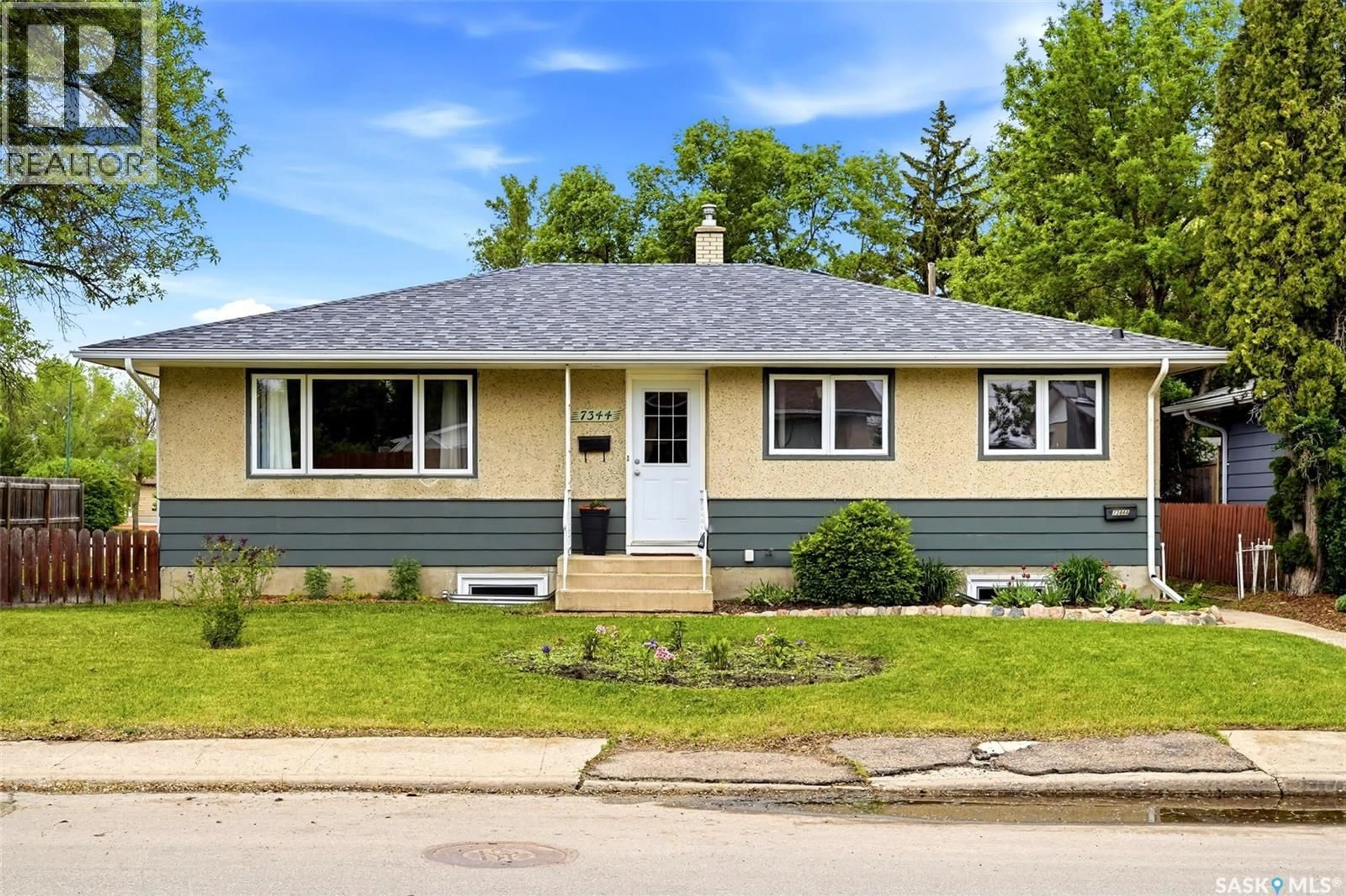 Home with vinyl exterior material, street for 7344 6TH AVENUE, Regina Saskatchewan S4T0P2