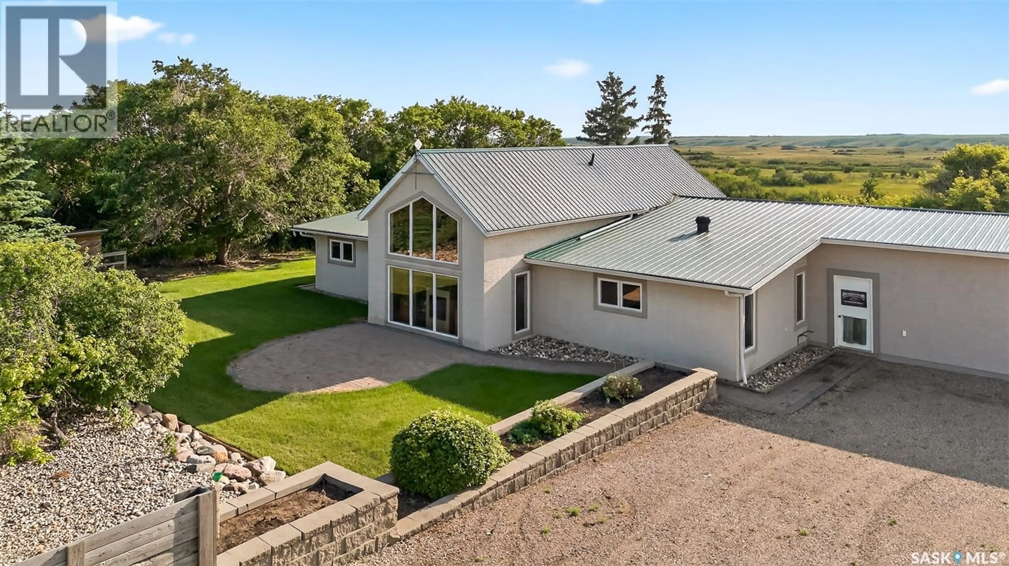 A pic from outside/outdoor area/front of a property/back of a property/a pic from drone, building for STONY BEACH DREAM SHOP ACREAGE, Pense Rm No. 160 Saskatchewan S0G0G0
