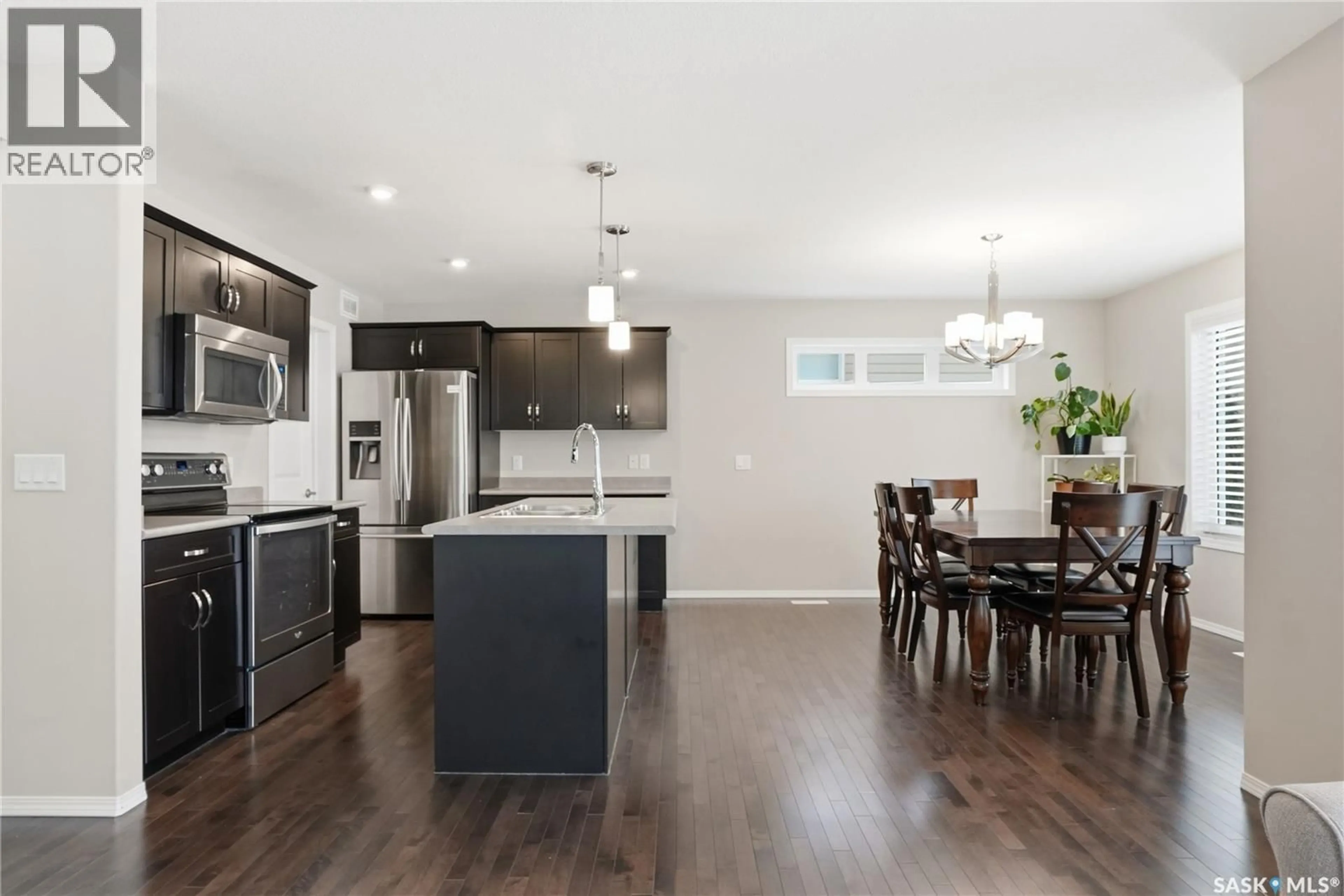 Open concept kitchen, wood/laminate floor for 366 KOLYNCHUK MANOR, Saskatoon Saskatchewan S7T0W4