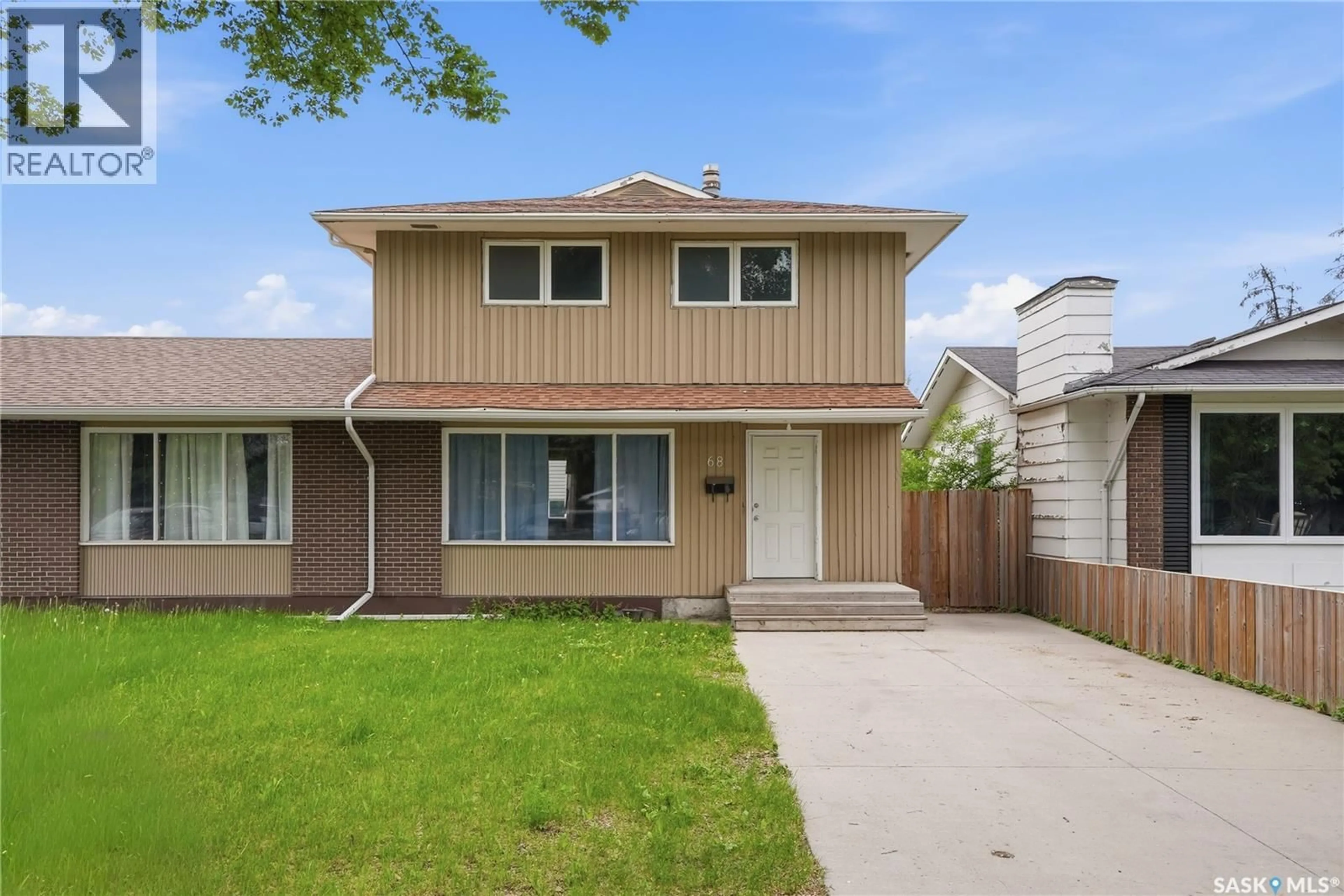 Home with vinyl exterior material, street for 68 CARLETON DRIVE, Saskatoon Saskatchewan S7H3N6