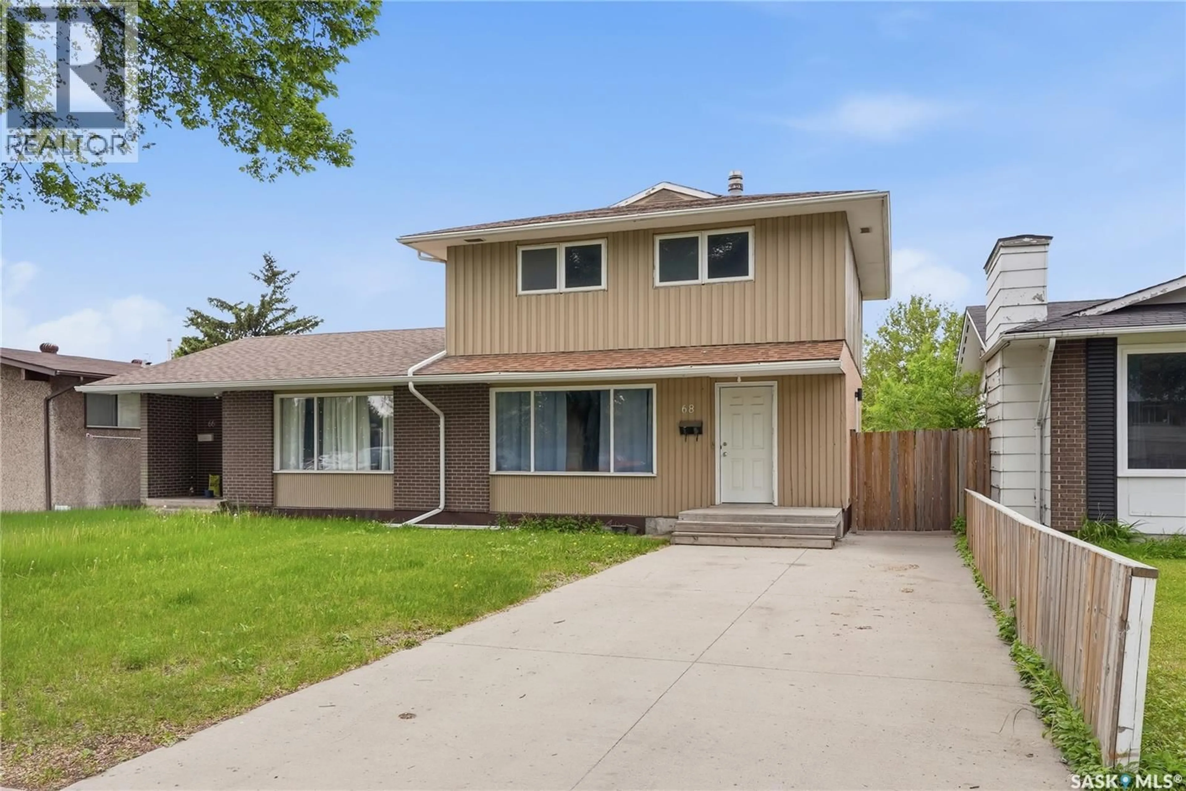 Home with vinyl exterior material, street for 68 CARLETON DRIVE, Saskatoon Saskatchewan S7H3N6