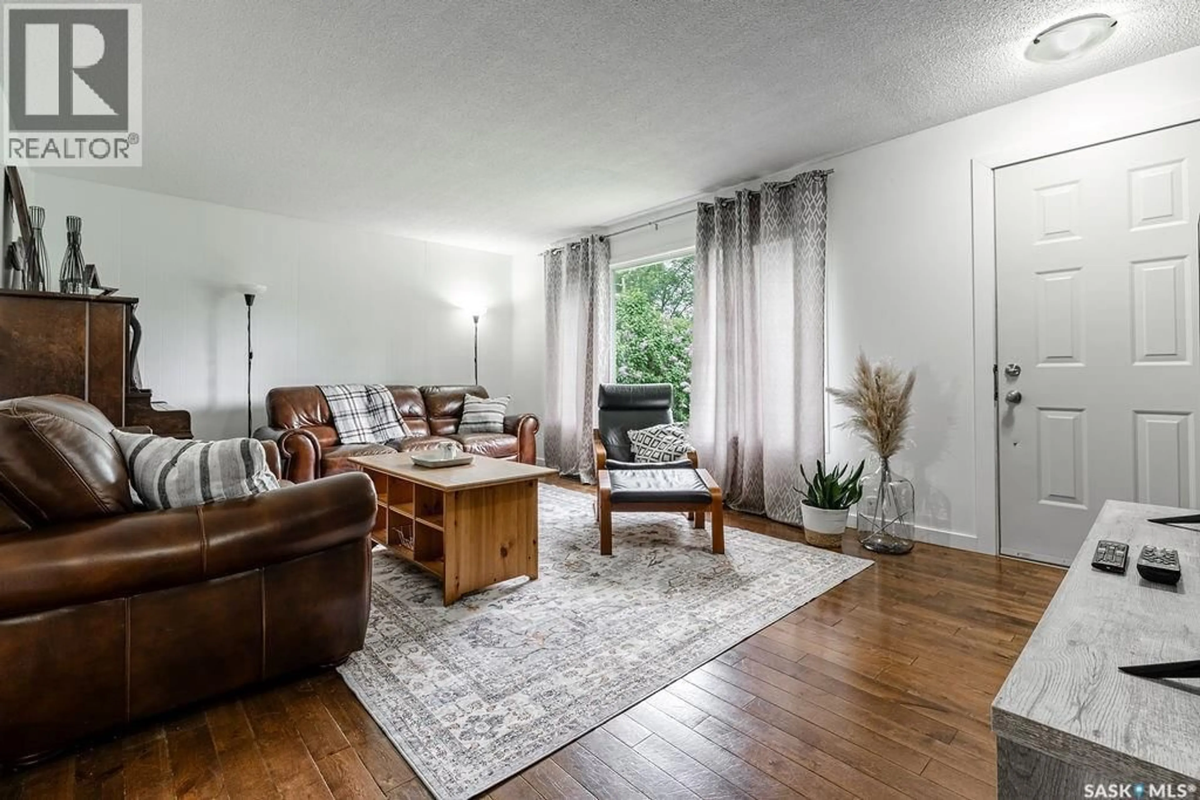 Living room with furniture, wood/laminate floor for 307 2ND AVENUE, Hepburn Saskatchewan S0K1Z0