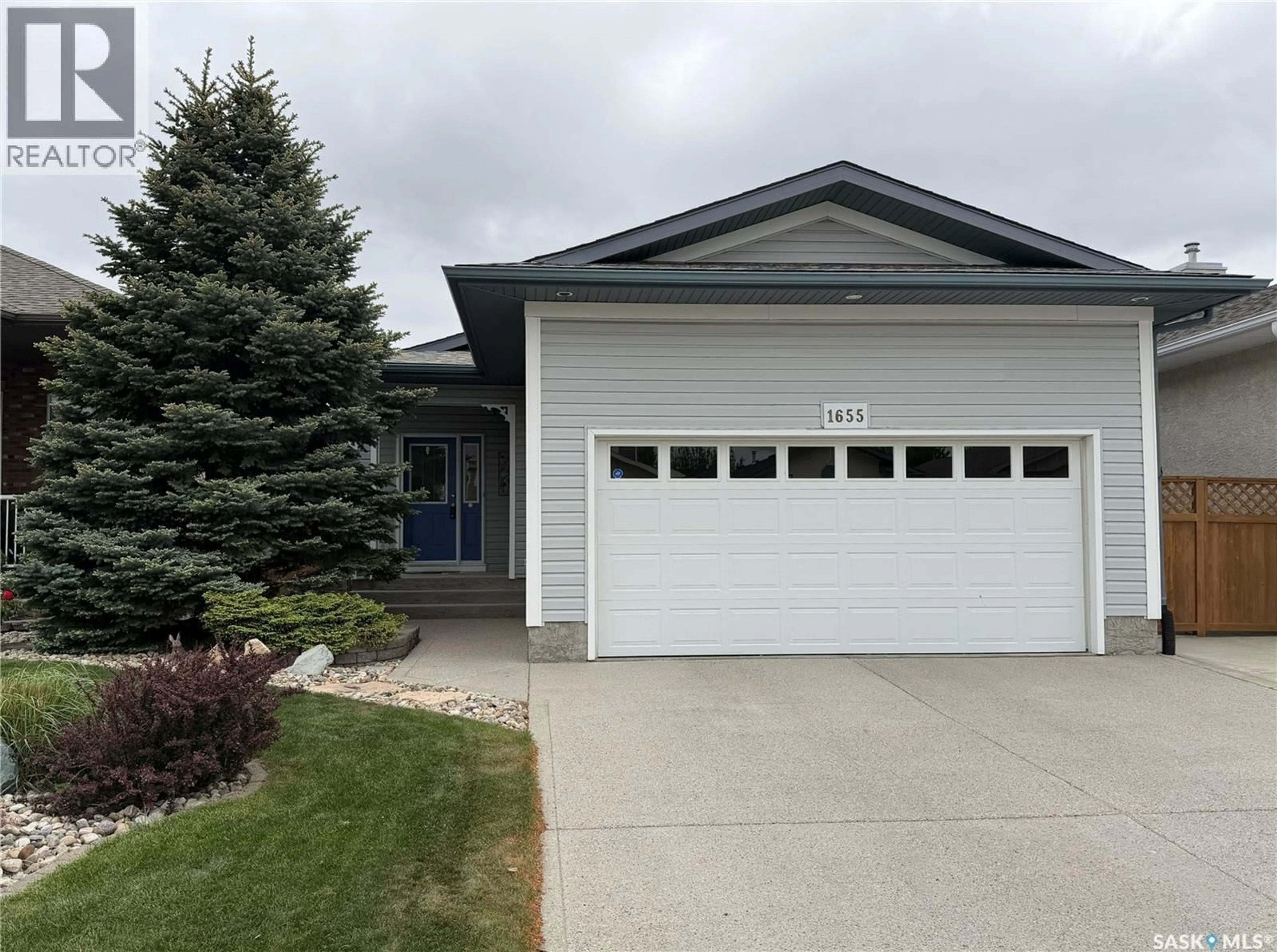 Home with vinyl exterior material, street for 1655 WINGERT DRIVE, Regina Saskatchewan S4X4P3