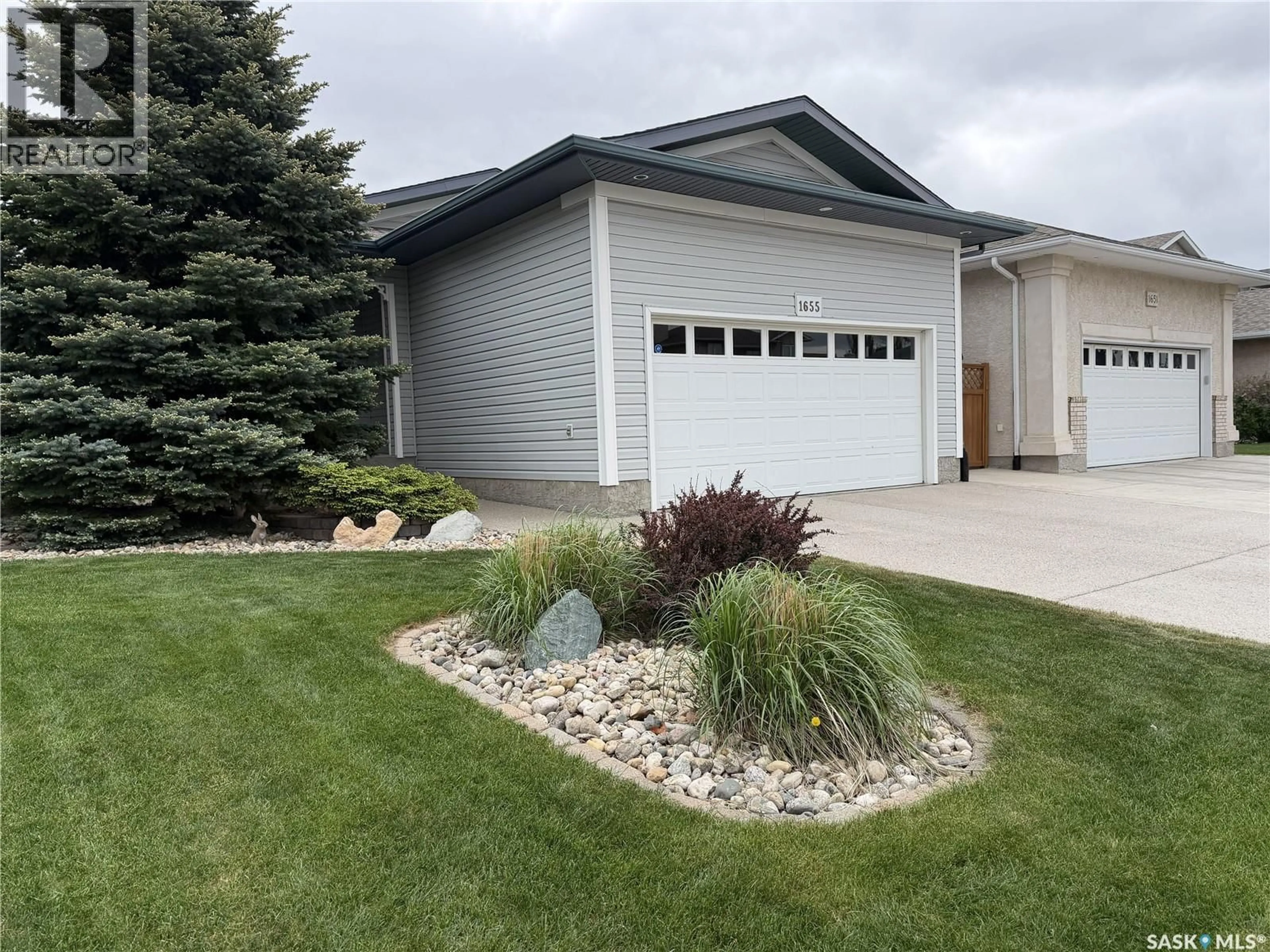 Home with vinyl exterior material, street for 1655 WINGERT DRIVE, Regina Saskatchewan S4X4P3