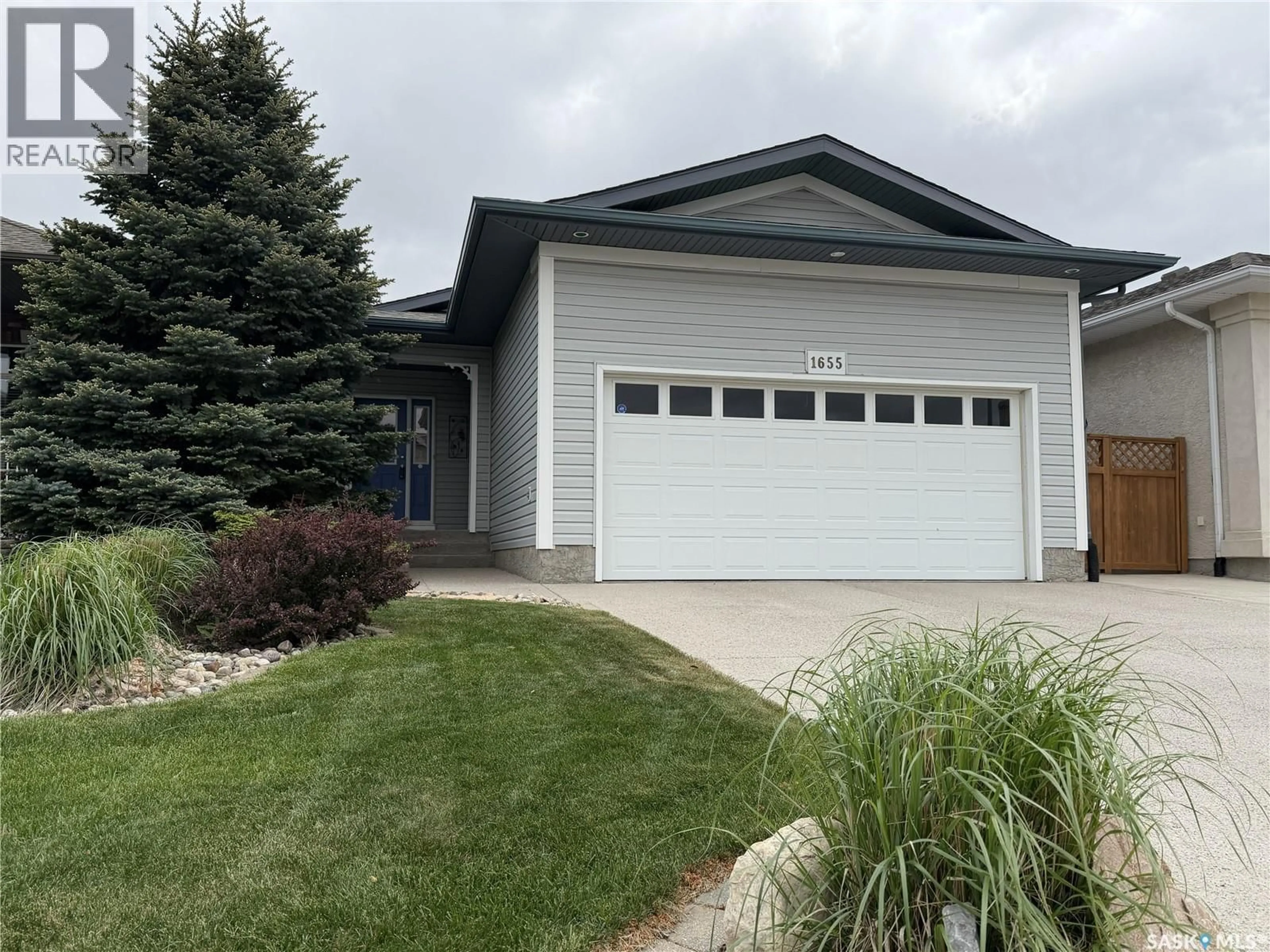 Home with vinyl exterior material, street for 1655 WINGERT DRIVE, Regina Saskatchewan S4X4P3