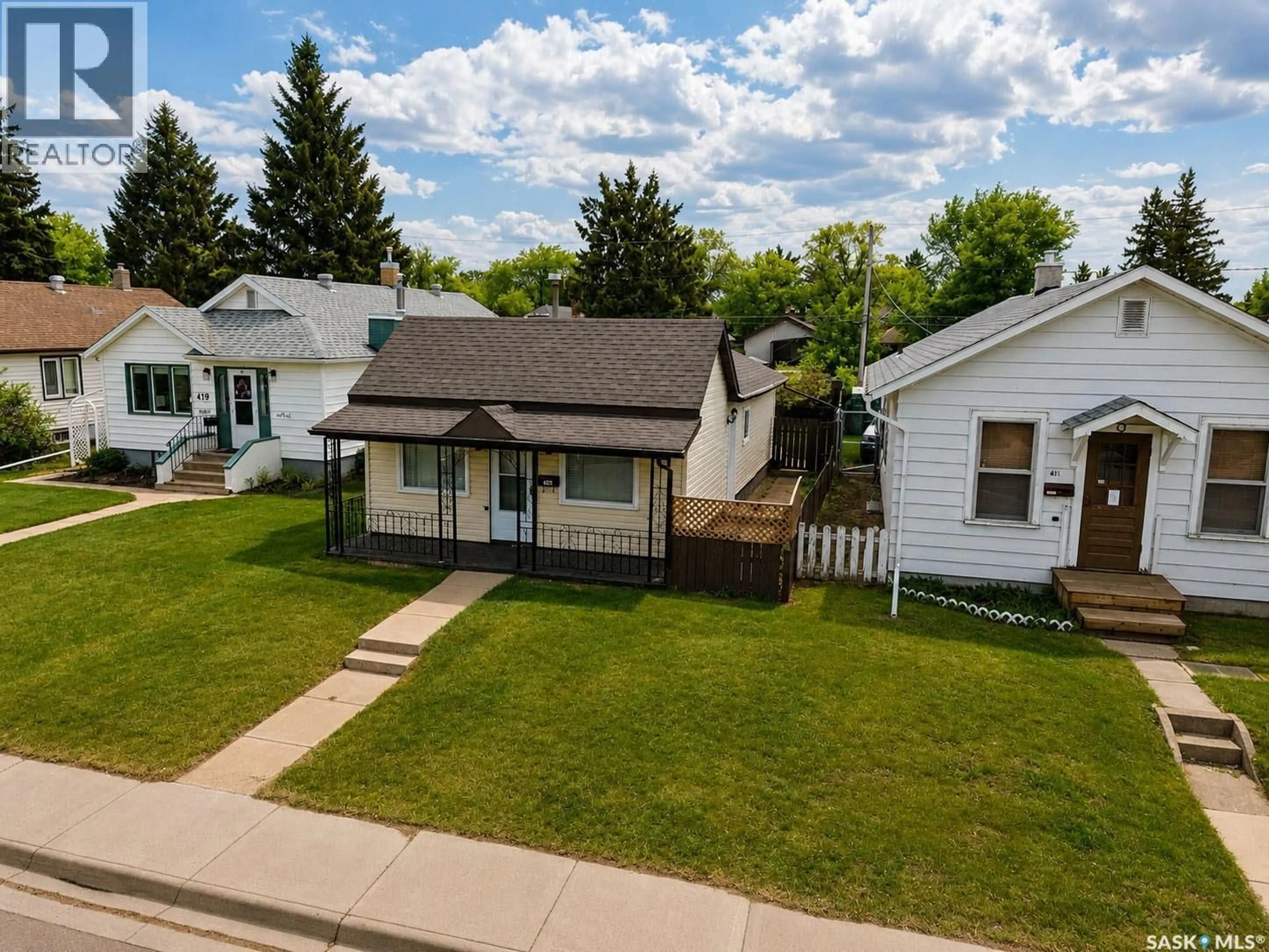 A pic from outside/outdoor area/front of a property/back of a property/a pic from drone, street for 415 8TH STREET, Prince Albert Saskatchewan S6V0V8