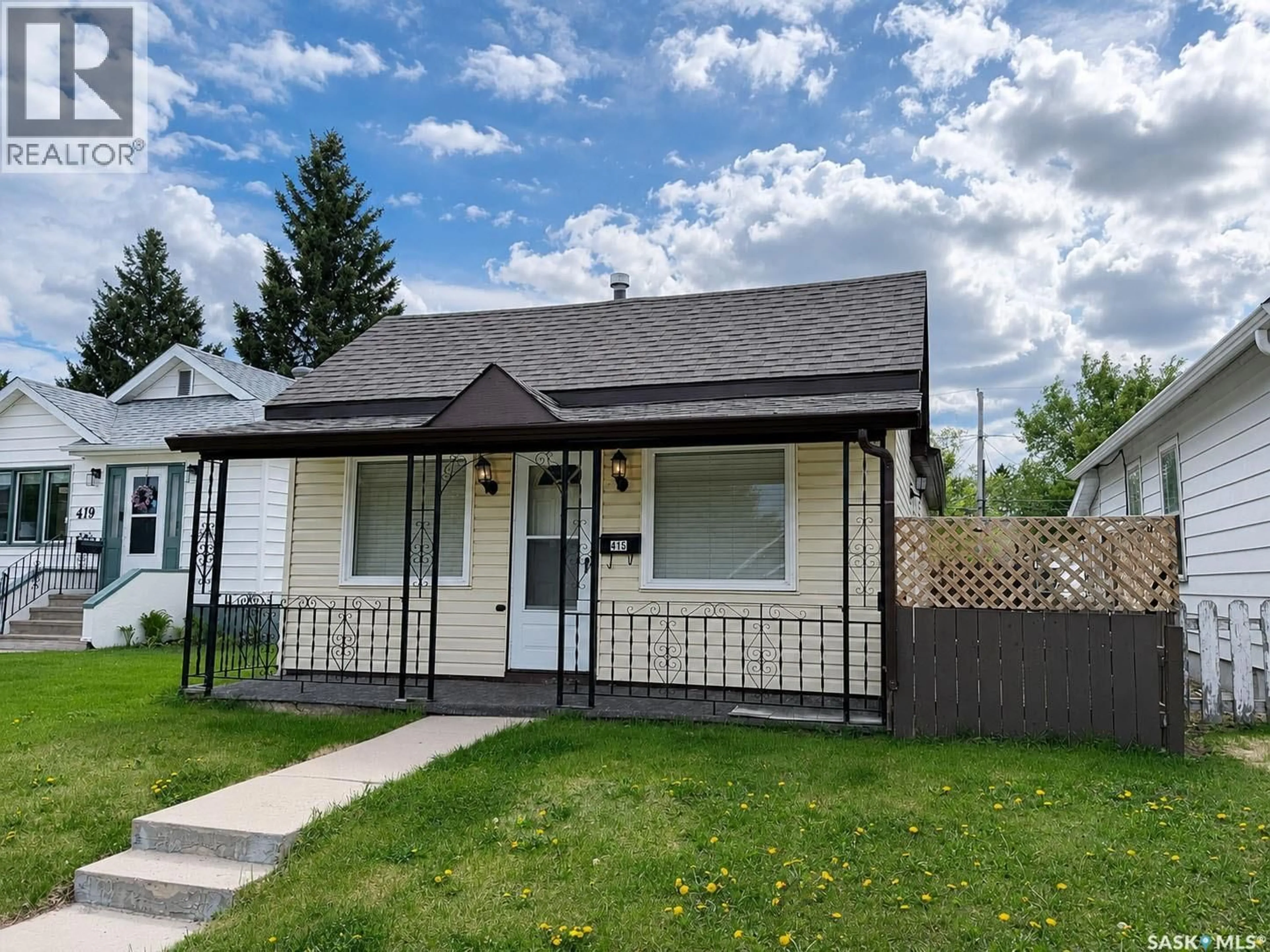 Home with vinyl exterior material, street for 415 8TH STREET, Prince Albert Saskatchewan S6V0V8