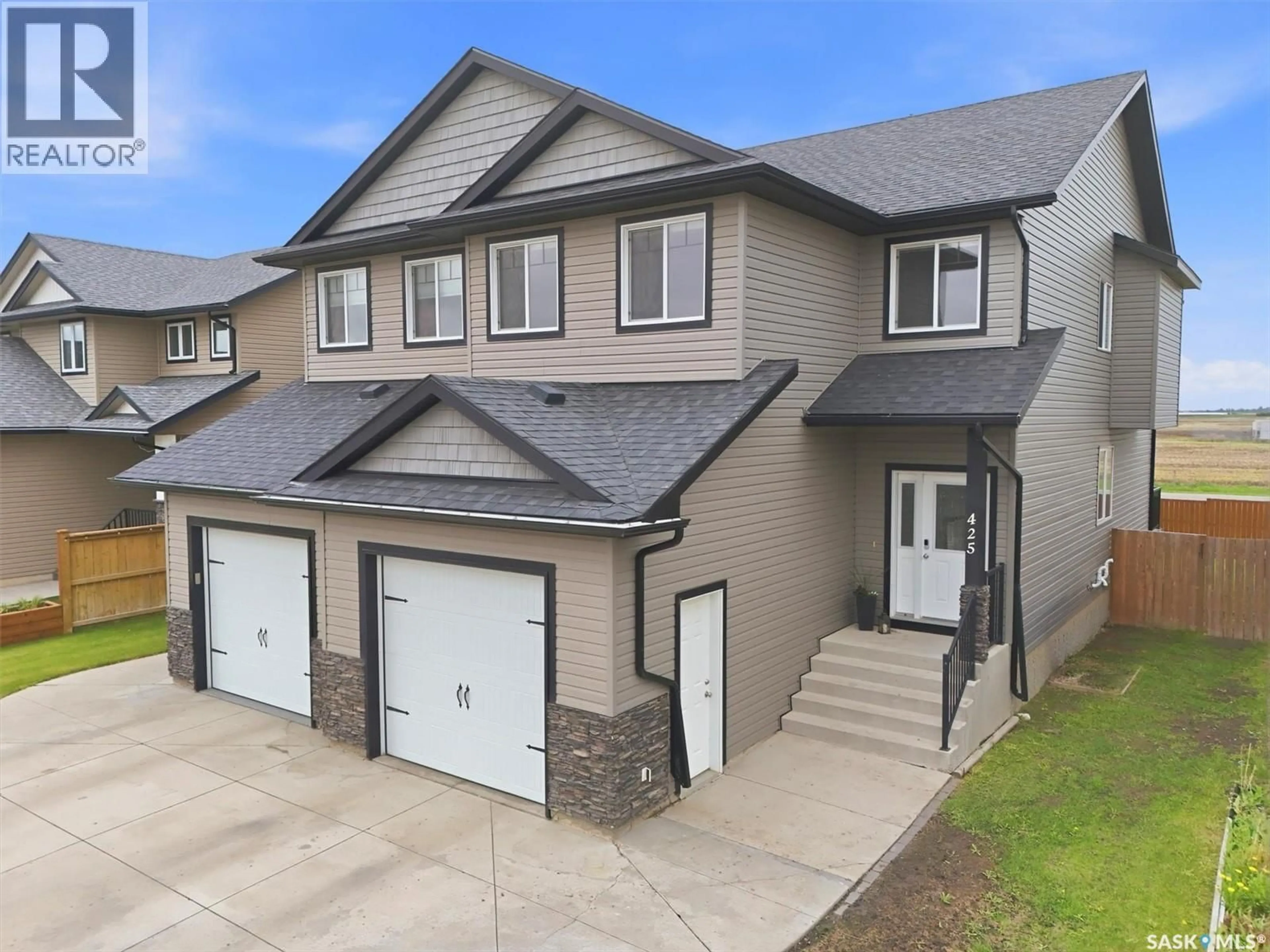 A pic from outside/outdoor area/front of a property/back of a property/a pic from drone, street for 425 REDWOOD CRESCENT, Warman Saskatchewan S0K4S2