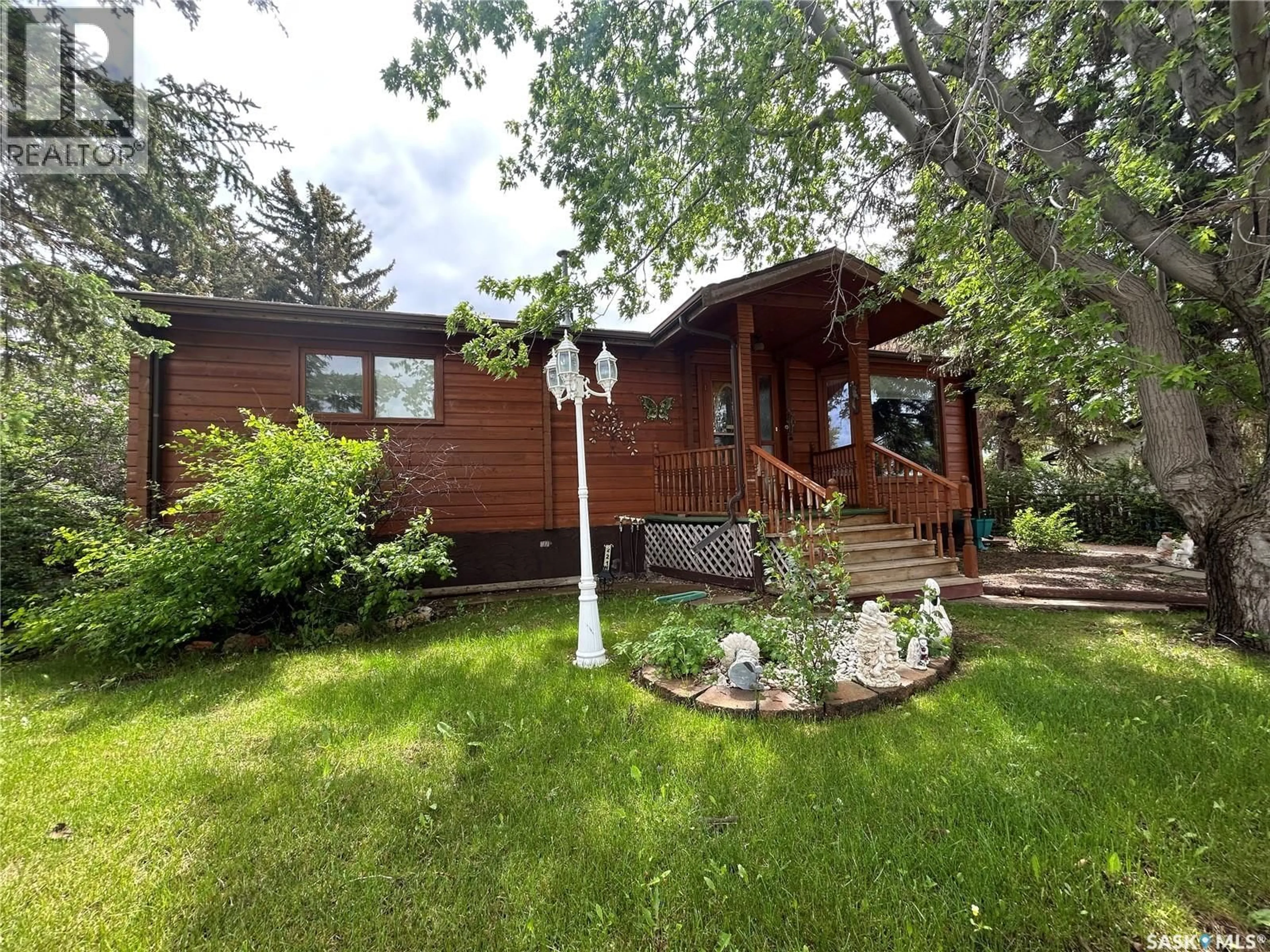 Home with vinyl exterior material, street for 221 1ST STREET, Coronach Saskatchewan S0H0Z0