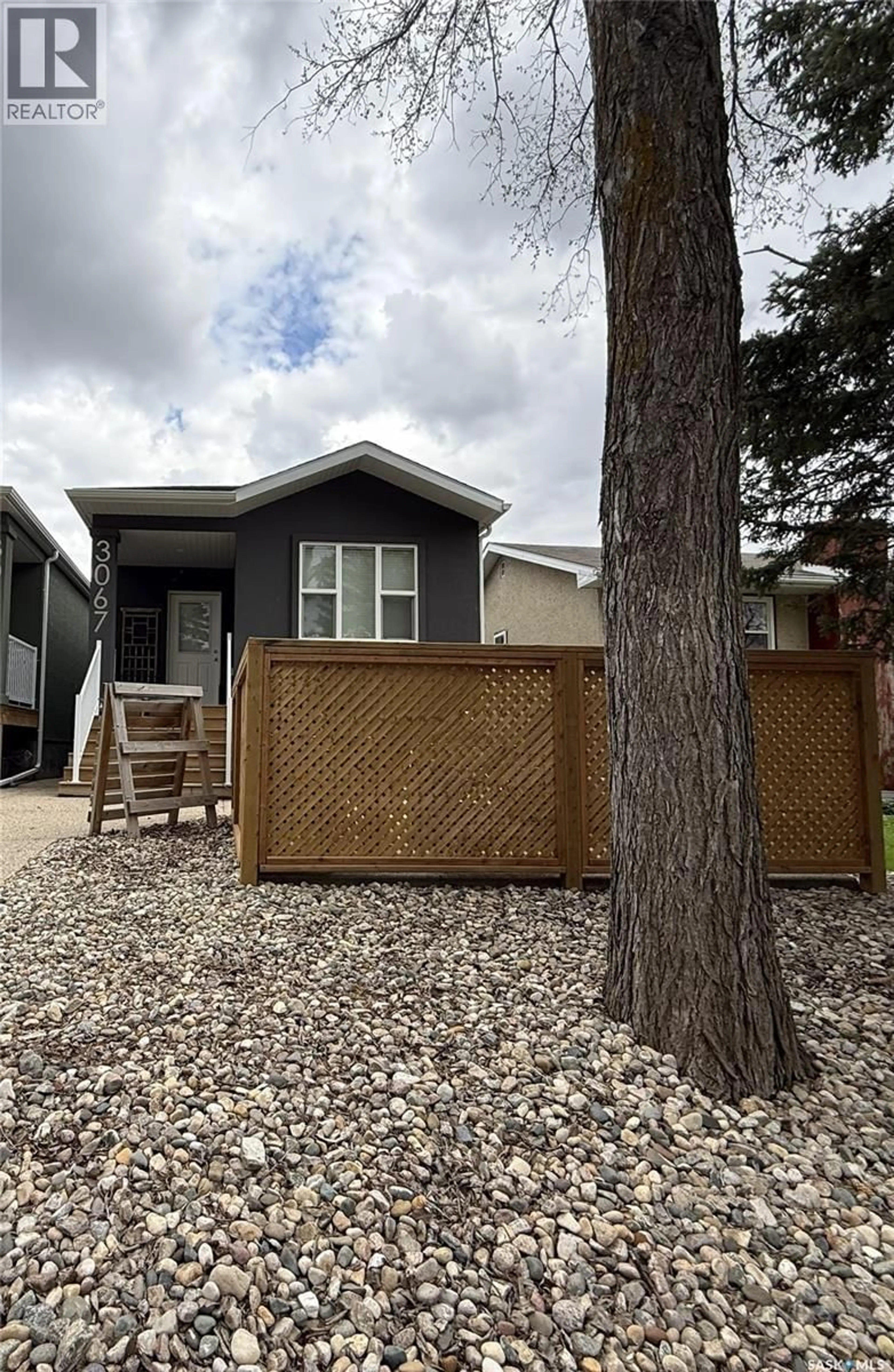 Home with vinyl exterior material, street for 3067 ELPHINSTONE STREET, Regina Saskatchewan S4S2A6