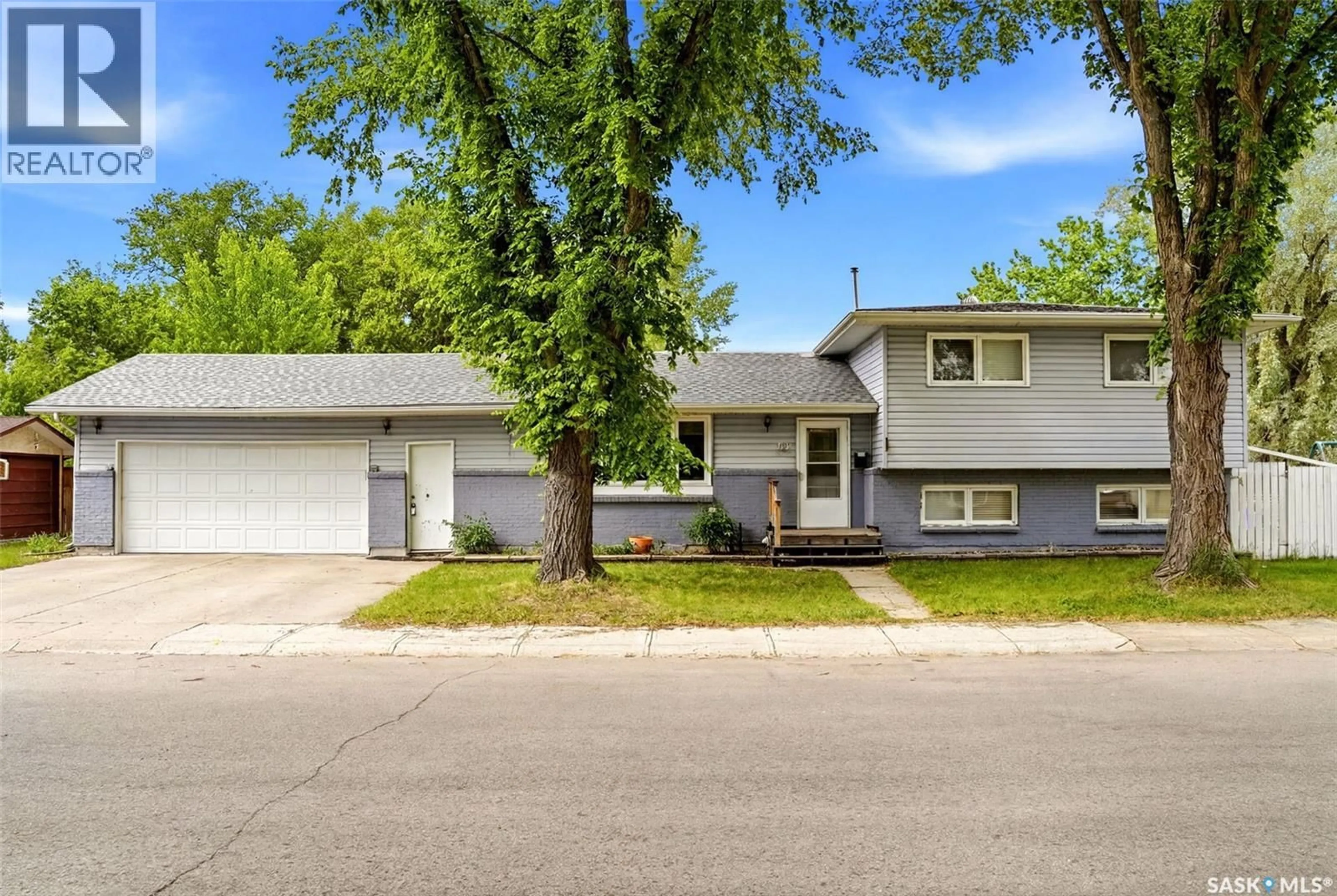 Home with vinyl exterior material, street for 14 WHEELER CRESCENT, Regina Saskatchewan S4R6H5