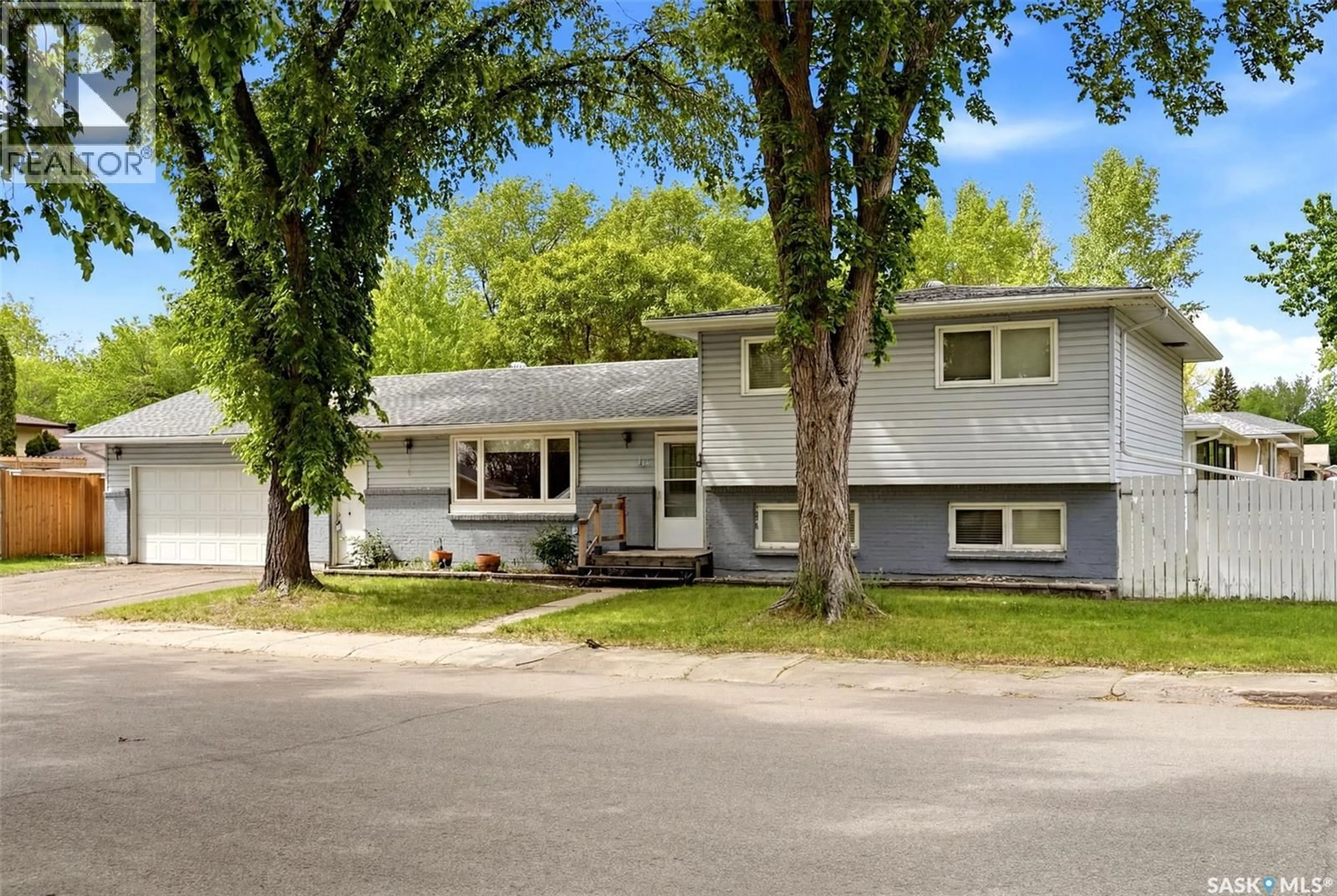 Home with vinyl exterior material, street for 14 WHEELER CRESCENT, Regina Saskatchewan S4R6H5