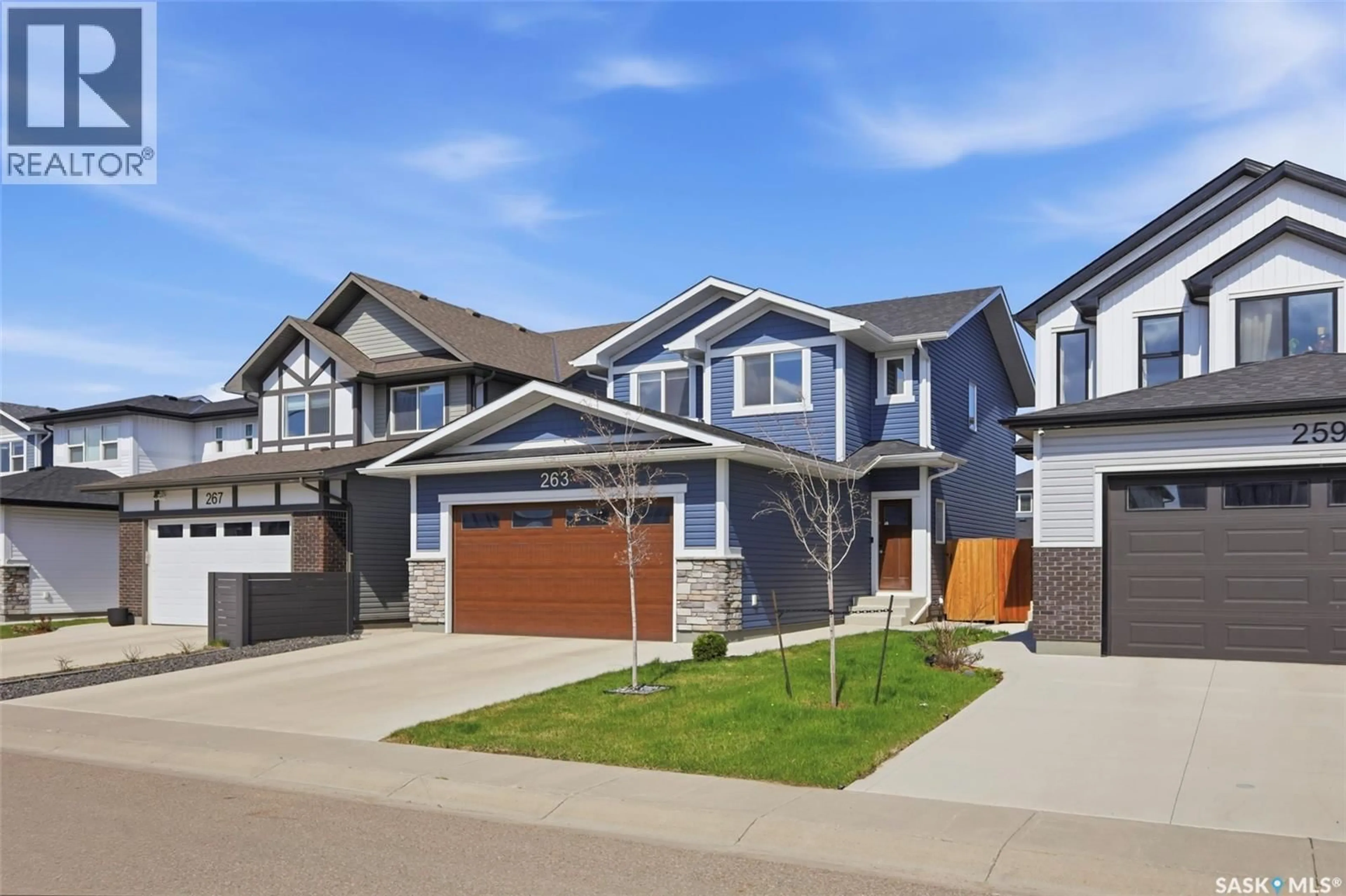 Home with vinyl exterior material, street for 263 SKOPIK CRESCENT, Saskatoon Saskatchewan S7V0V6