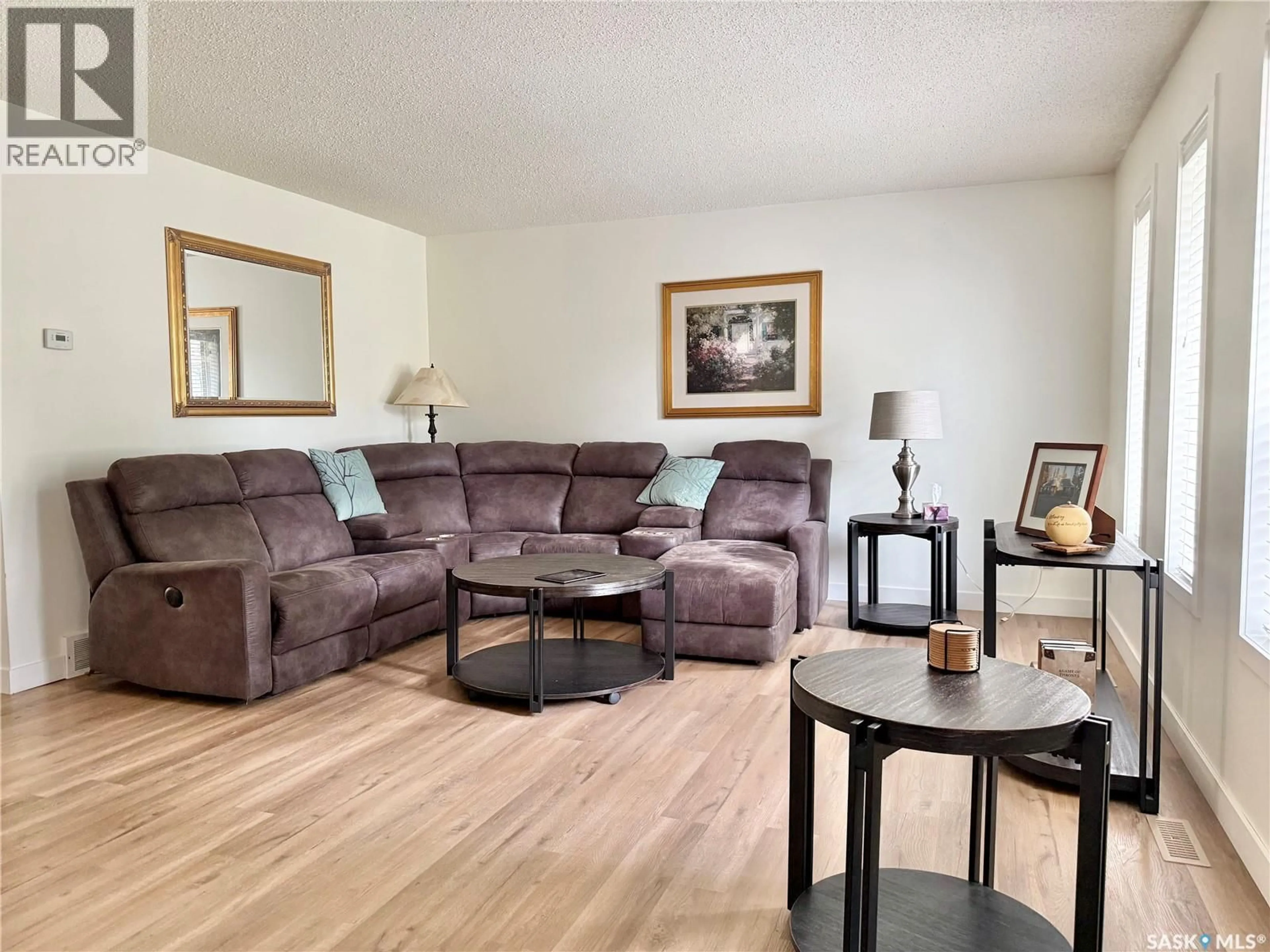 Living room with furniture, wood/laminate floor for 405 3RD AVENUE, Leask Saskatchewan S0J1M0