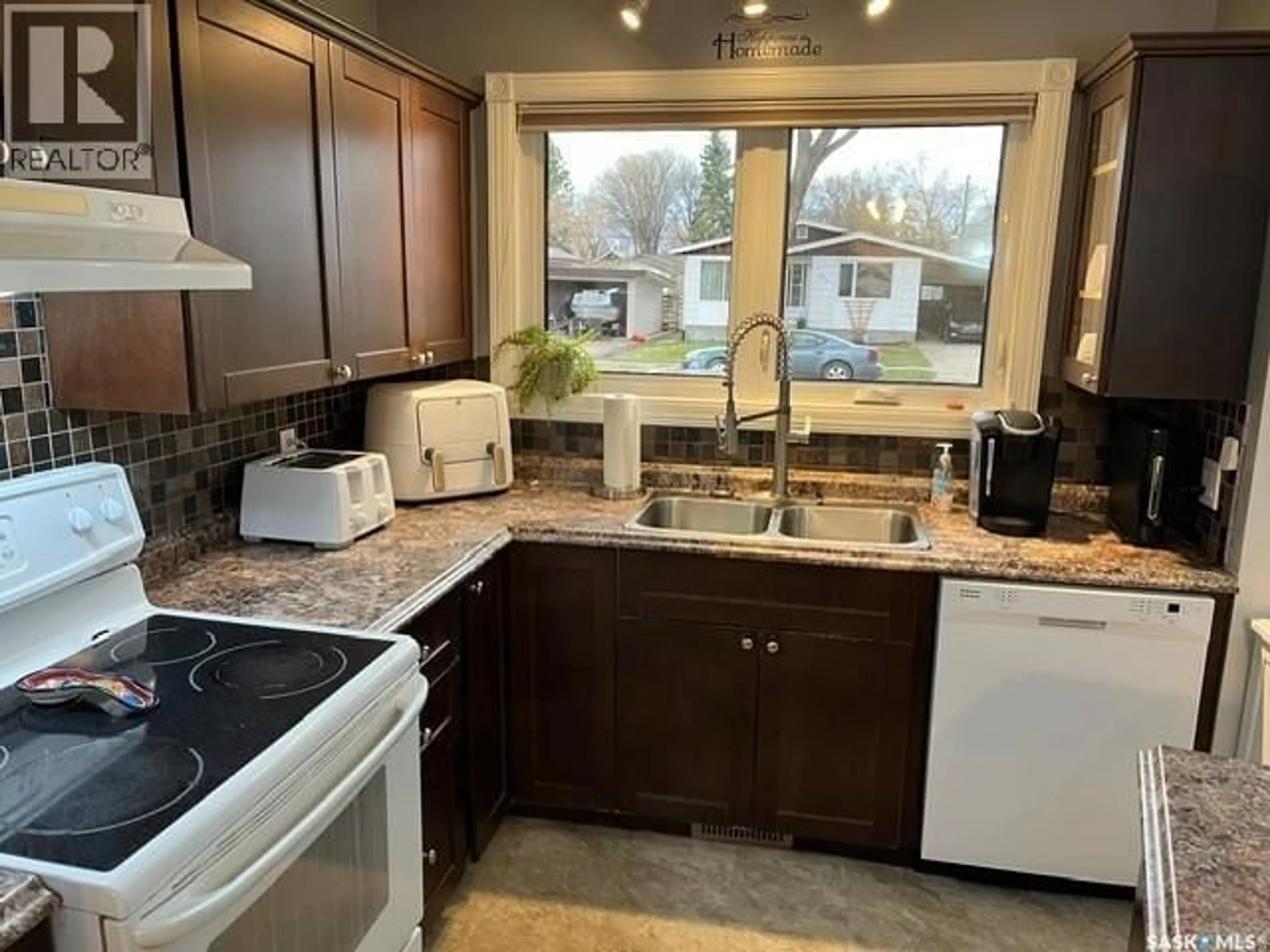 Open concept kitchen, ceramic/tile floor for 206 3RD AVENUE, Canora Saskatchewan S0A0L0